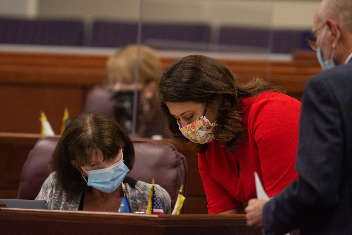 Assembly Majority Floor Leader Teresa Benitez-Thompson, right, speaks with Deputy Minority Whip Robin Titus, on Friday, July 31, 2020 during the first day of the 32nd Special Session of the Legislature in Carson City.