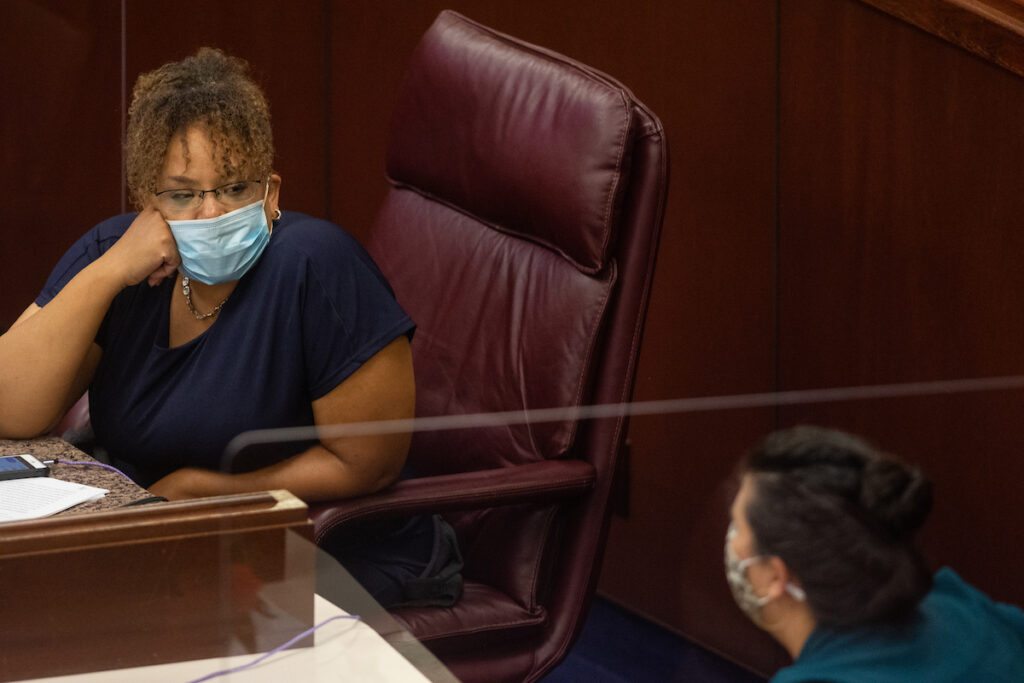 Assemblywoman Neal, left, speaks with Nguyen inside the Assembly chambers on Friday, July 31, 2020 during the first day of the 32nd Special Session of the Legislature in Carson City.