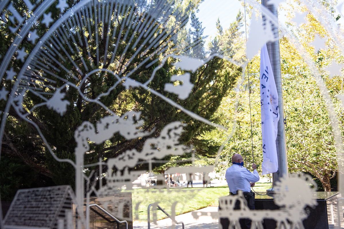 A Legislative police officer raised the flag of the Legislature on Friday, July 31, 2020 during the first day of the 32nd Special Session of the Legislature in Carson City.