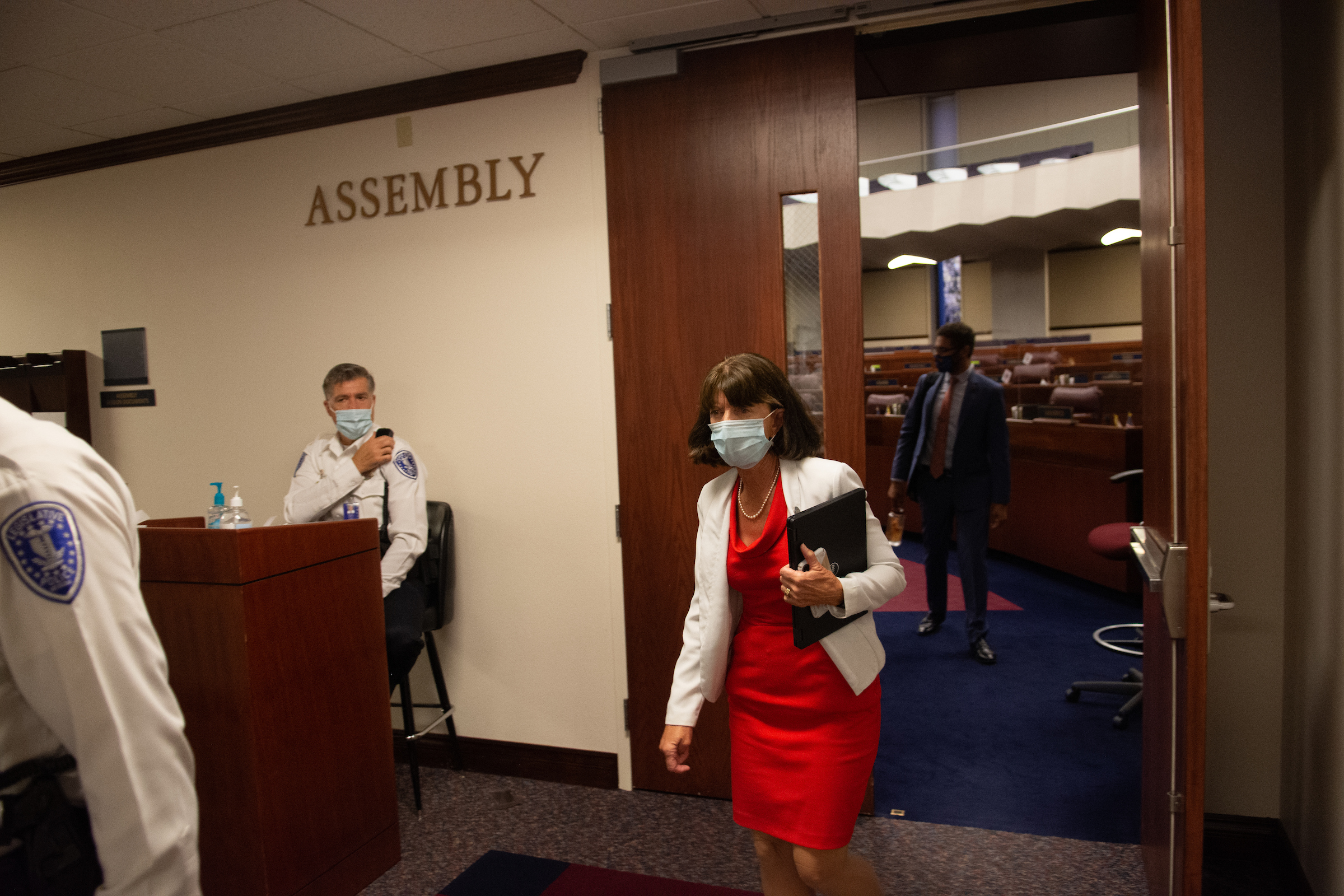 Assemblywoman Robin Titus walking out of the Assembly