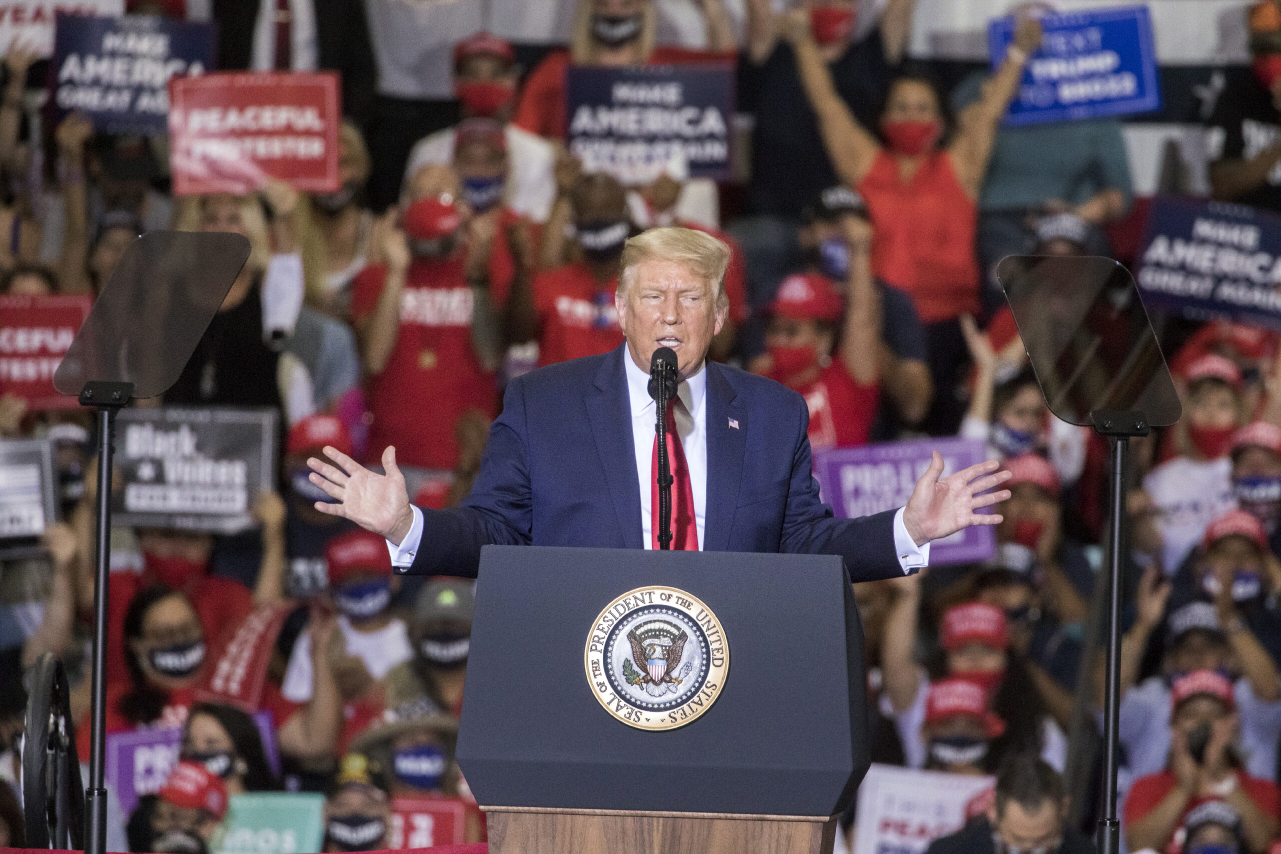 Trump rallies thousands of supporters at indoor rally in defiance of