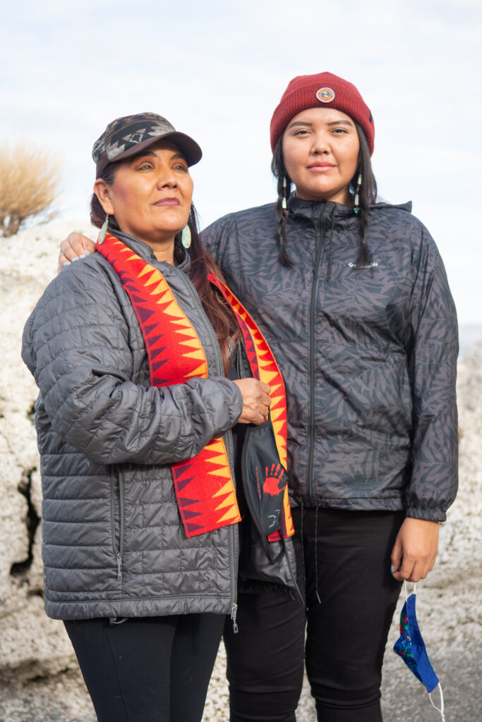 Mother and daughter pose for a photo