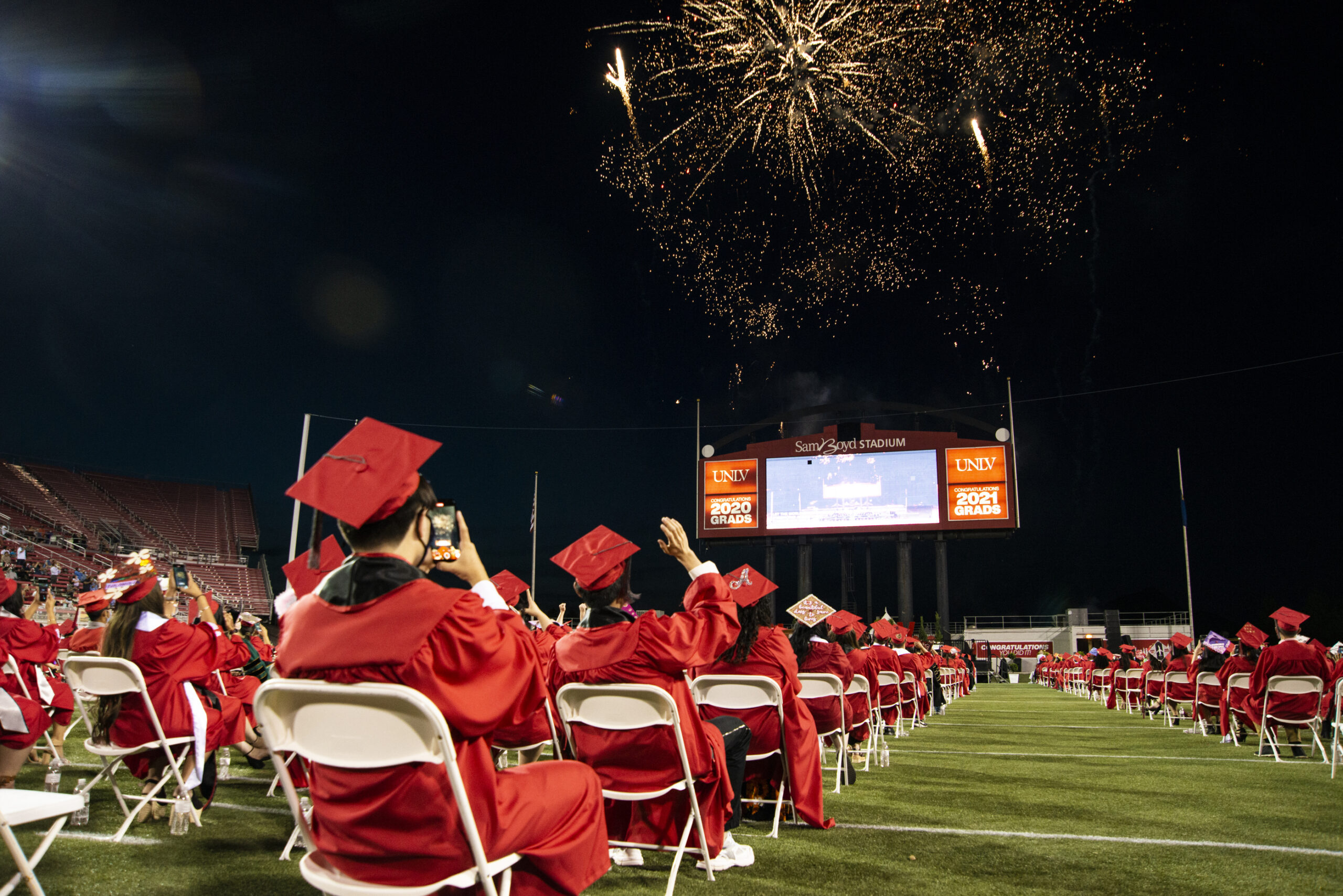 Students from the University of Nevada, Las Vegas graduating class fo 2020 participate in a make-up graduation ceremony at Sam Boyd Stadium in Las Vegas on Friday, May 14, 2021. (Daniel Clark/The Nevada Independent).