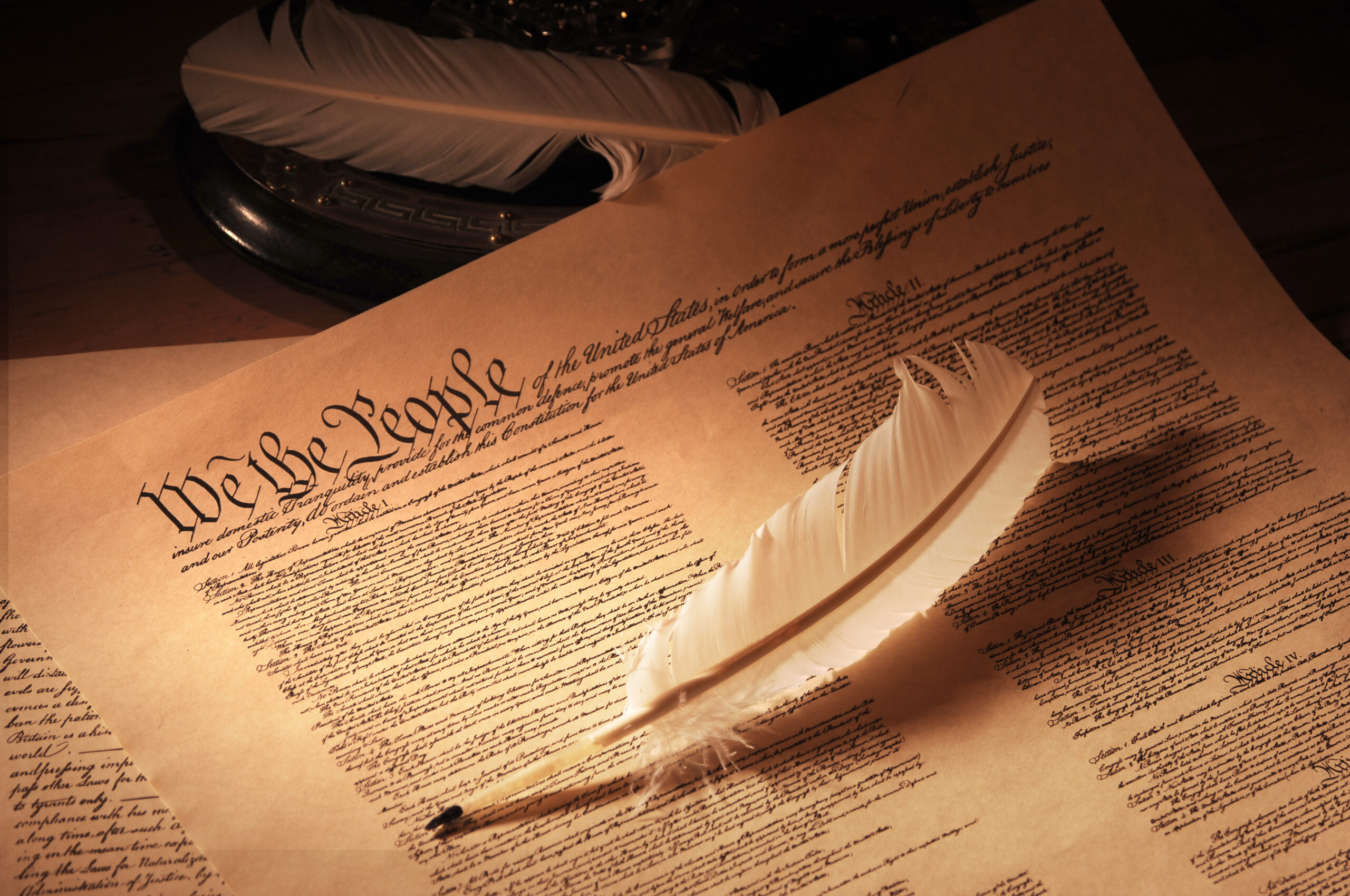 U.S. Constitution with quill pen.