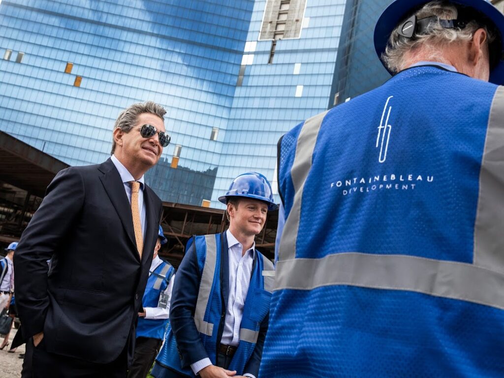 Jeffrey Soffer, left, CEO of Fontainebleau Development, and Jake Francis, president of Koch Real Estate Investments, far right, during the commencement ceremony at Fontainebleau Las Vegas on Tuesday, Nov. 9, 2021. (Jeff Scheid/The Nevada Independent)