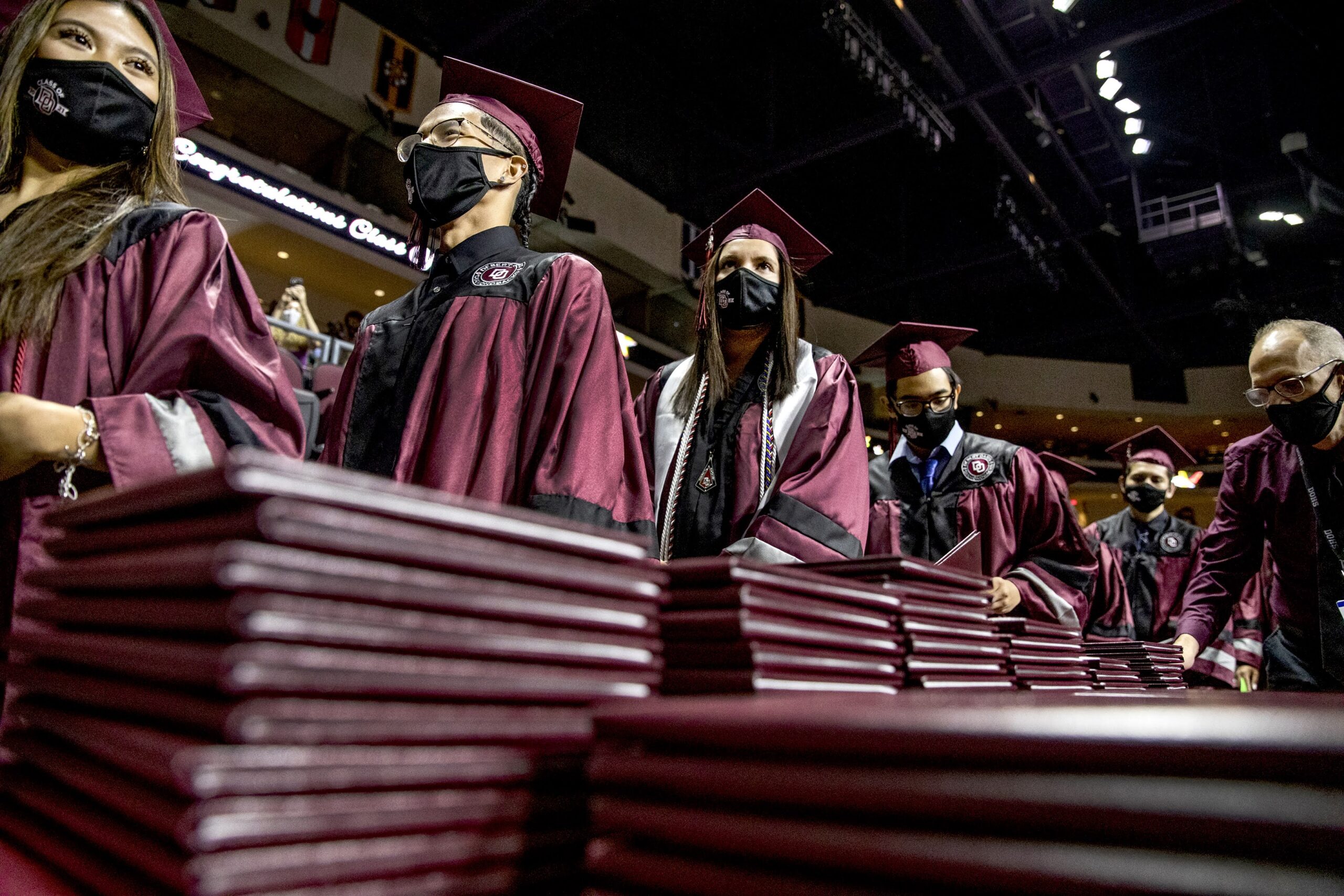 Graduation rate hits new high but trouble spots remain among