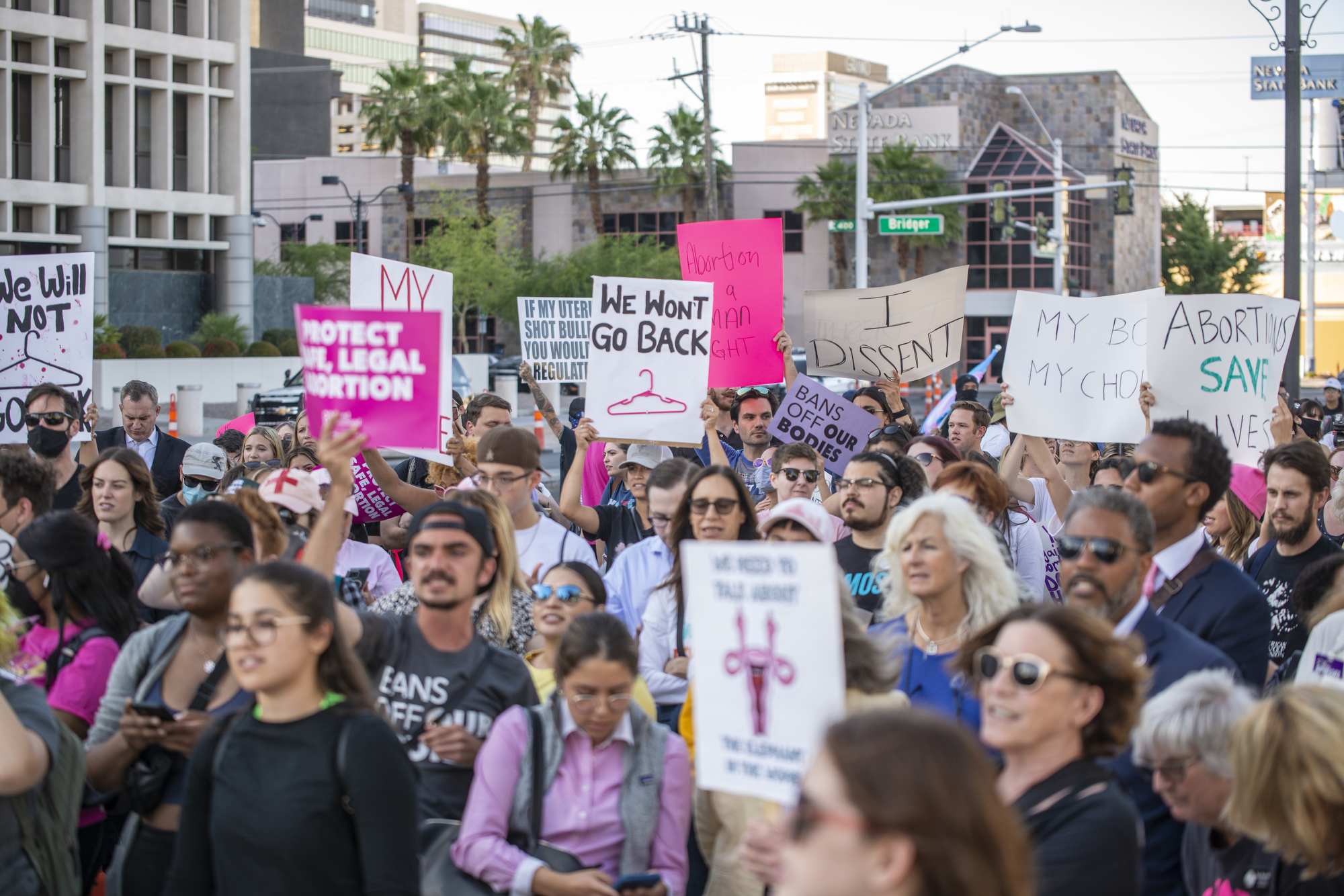 A crowd gathers during a reproductive health rights demonstration in front of the Lloyd D George Federal Courthouse in downtown Las Vegas on Tuesday, May 3, 2022. (Daniel Clark/The Nevada Independent).