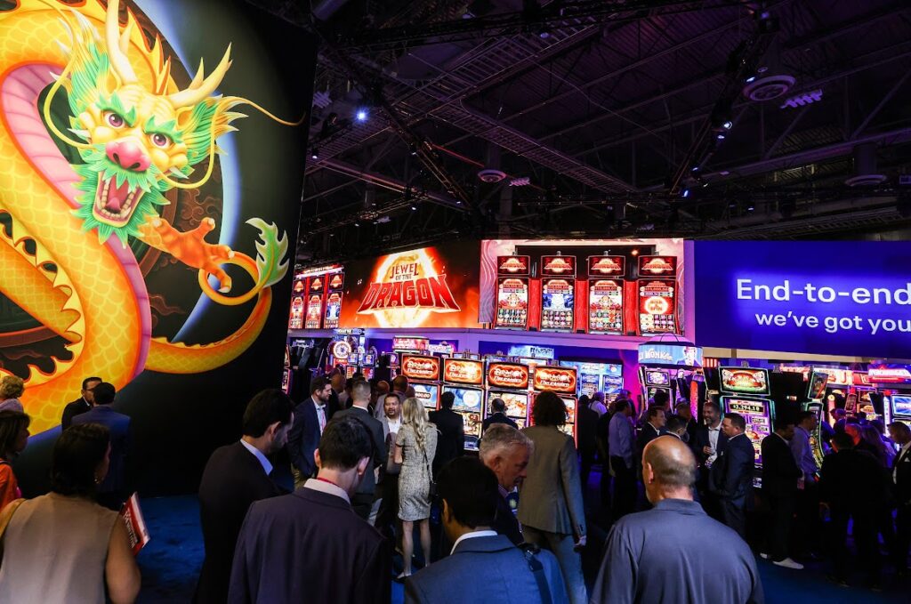 Attendees gather at the Light & Wonder booth during G2E on Tuesday, Oct. 11, 2022. (Jeff Scheid/The Nevada Independent)