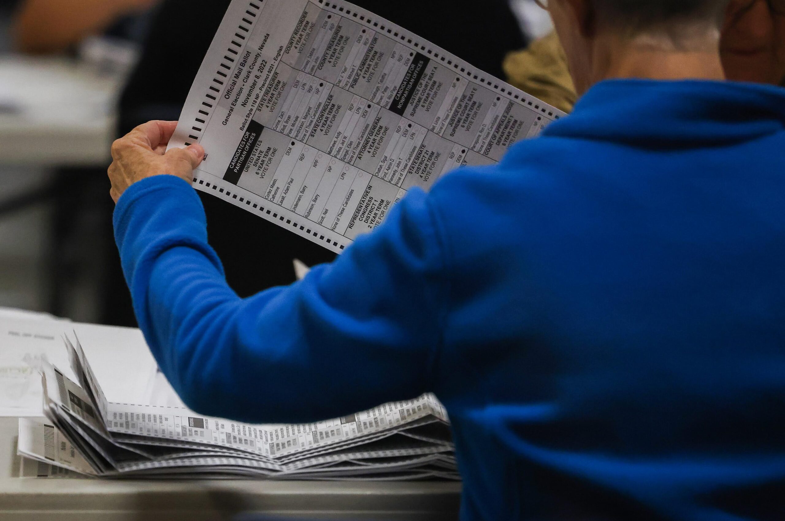 Election staff examine mail-in ballots at the Clark County Election Center on Thursday, Nov. 10, 2022. (Jeff Scheid/The Nevada Independent).