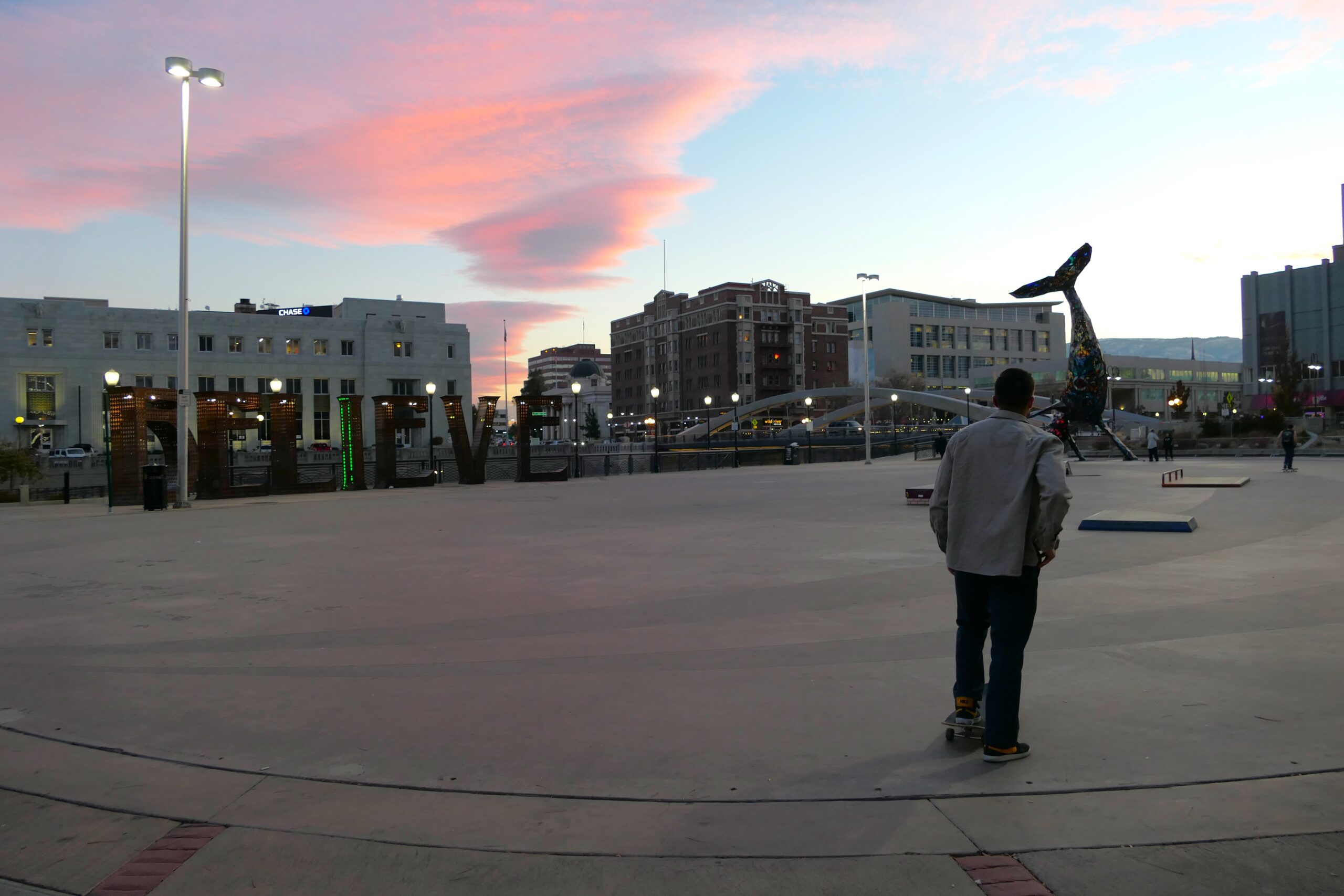 Person stands in front of Reno city plaza