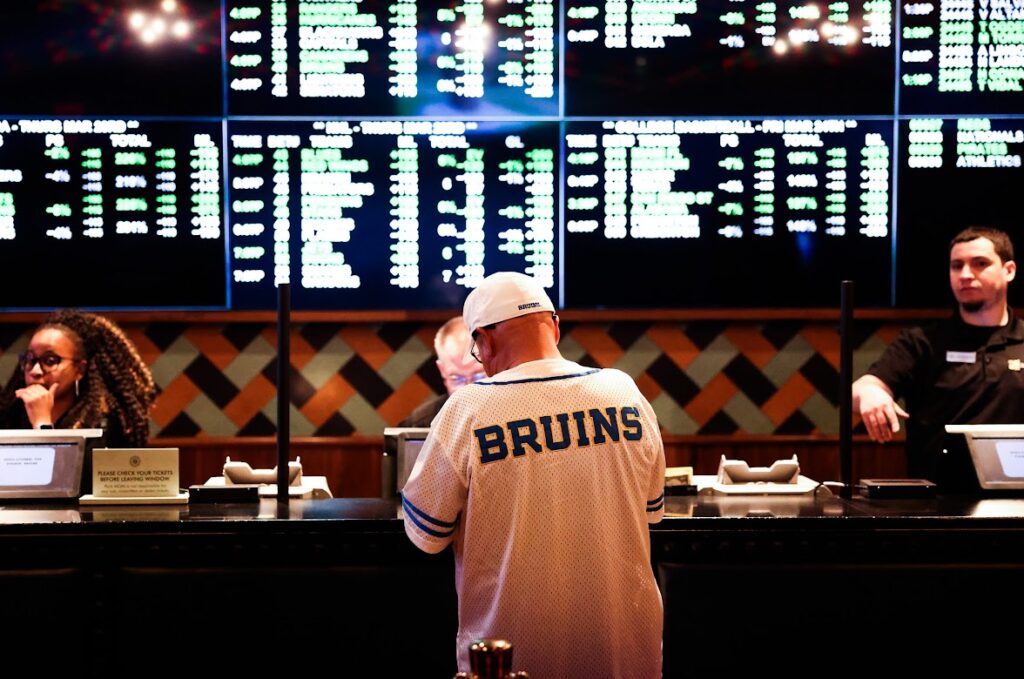 A UCLA fan places a wager on the Bruins at the BetMGM sportsbook inside Park MGM before the team took on Gonzaga in the NCAA West Regional semifinal at nearby T-Mobile Arena on Thursday, March 23, 2023. (Jeff Scheid/The Nevada Independent)