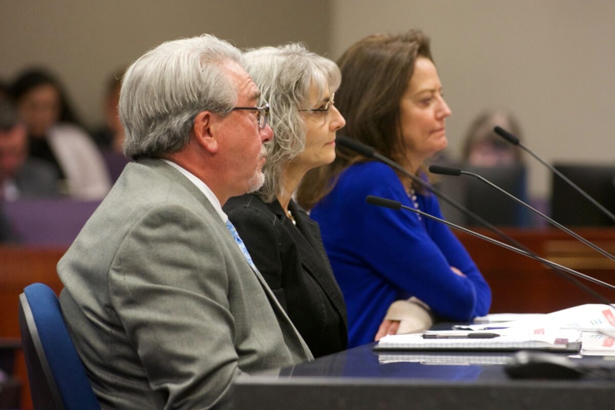 Three NV Energy executives — Tony Sanchez, executive vice president of business development and external relations, left, Janet Wells, vice president of regulatory, and Carolyn Barbash, vice president of transmission development and policy — testify in opposition to AB524 inside the Legislature in Carson City on May 30, 2023. (David Calvert/The Nevada Independent)