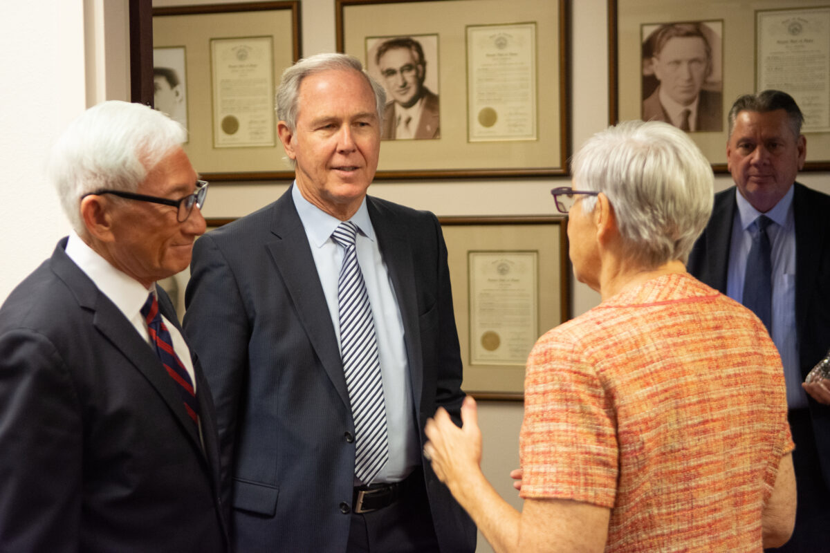 Brandon Birtcher, center, co-owner and CEO of Birtcher Development and consultant Victor Wei, left, greet Sen. Roberta Lange (D-Las Vegas) inside the Senate Leadership office at the Legislature on Thursday, May 11, 2023, in Carson City. (David Calvert/The Nevada Independent).