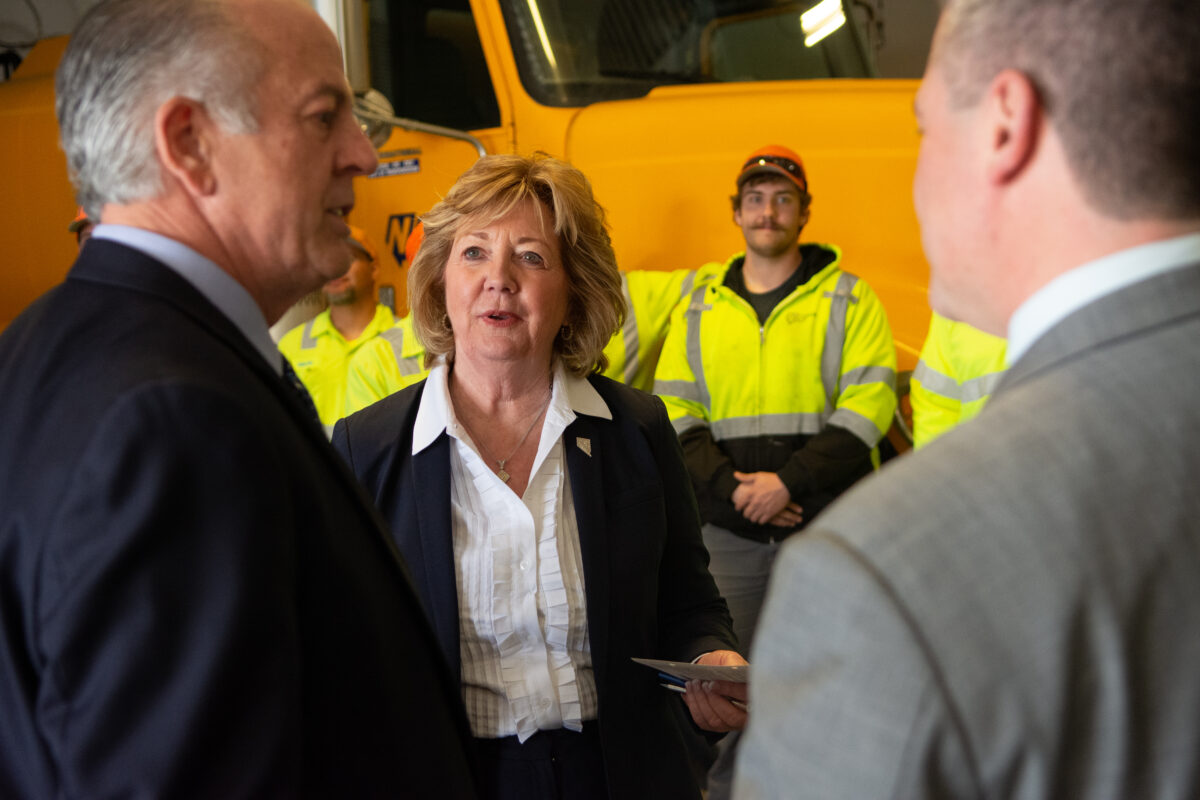 Senator Marilyn Dondero-Loop speaks to Governor Joe Lombardo, left, and Assembly Speaker Steve Yeager following a signing ceremony for AB 268 at the Nevada Department of Transportation's headquarters on April 4, 2023, in Carson City. (David Calvert/The Nevada Independent).