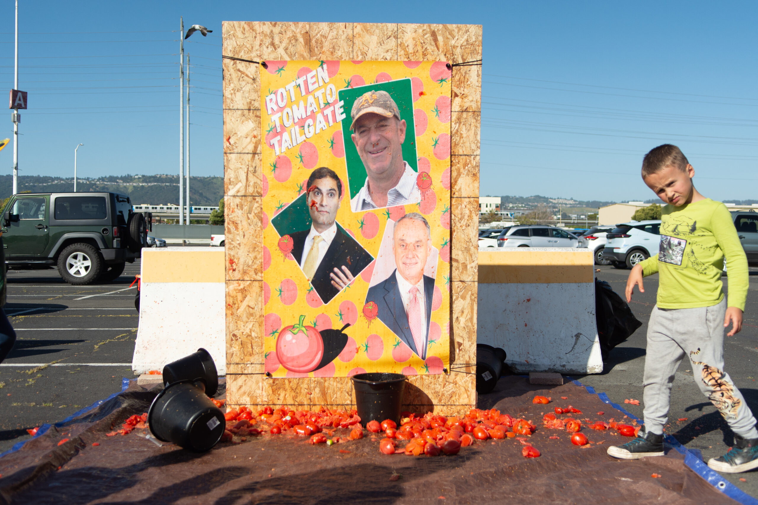 Fan threw tomatoes at photos of the leadership of the Oakland Athletics prior to the team's game against the Texas Rangers at the Oakland Coliseum in Oakland, California, on Friday, May 12, 2023. (David Calvert/The Nevada Independent).