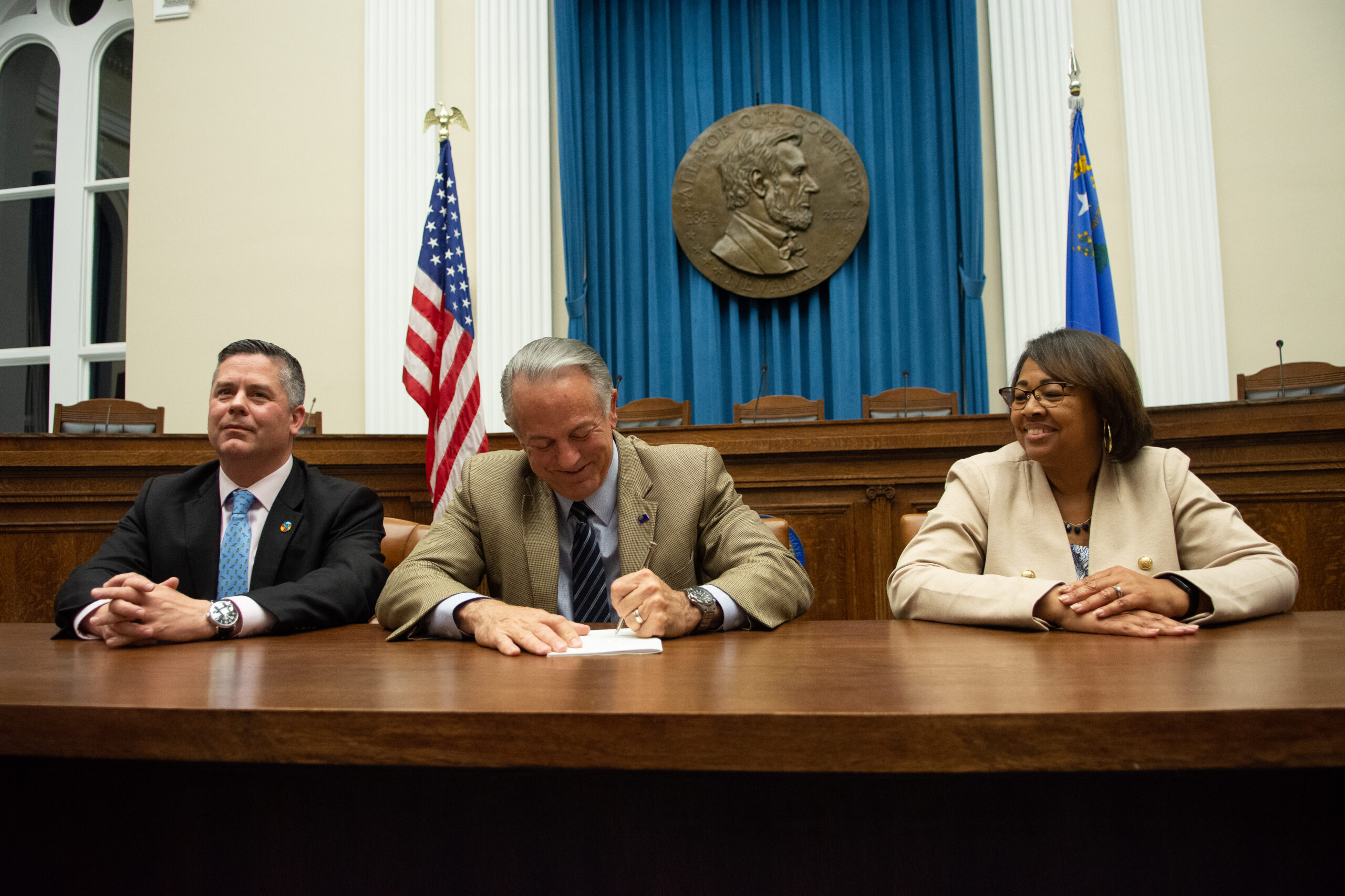 From left, Assembly Speaker Steve Yeager (D-Las Vegas), Gov. Joe Lombardo and Assemblywoman Daniele Monroe-Moreno (D-North Las Vegas) during a bill signing ceremony for SB503, the K-12 education funding bill, inside the Capitol in Carson City on May 31, 2023. (David Calvert/The Nevada Independent).