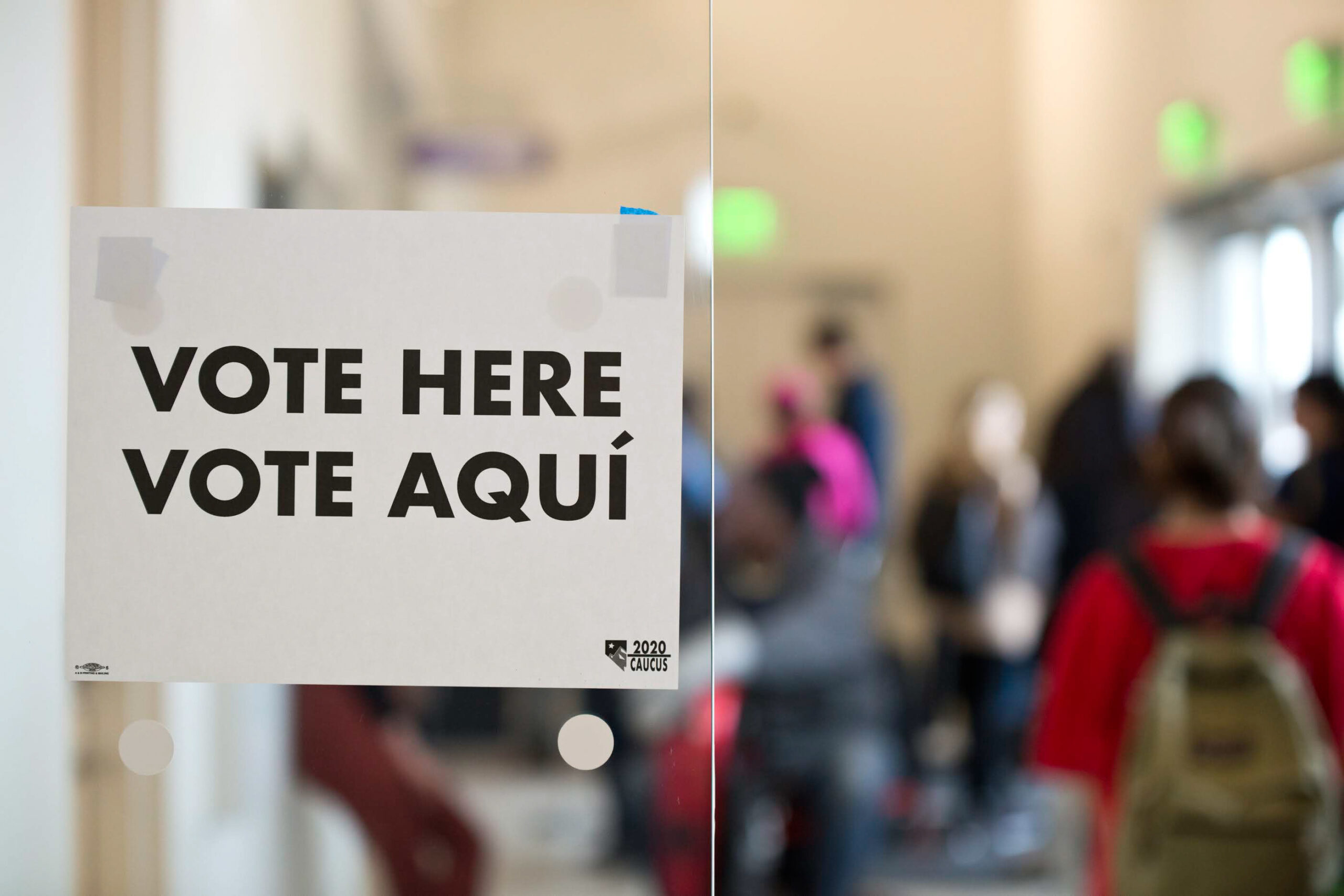 Signage that reads "Vote Here Vote Aquí" as seen during the first day of early voting for the Nevada Caucus at the East Las Vegas Library on Saturday, Feb. 15, 2020. (Daniel Clark/The Nevada Independent)