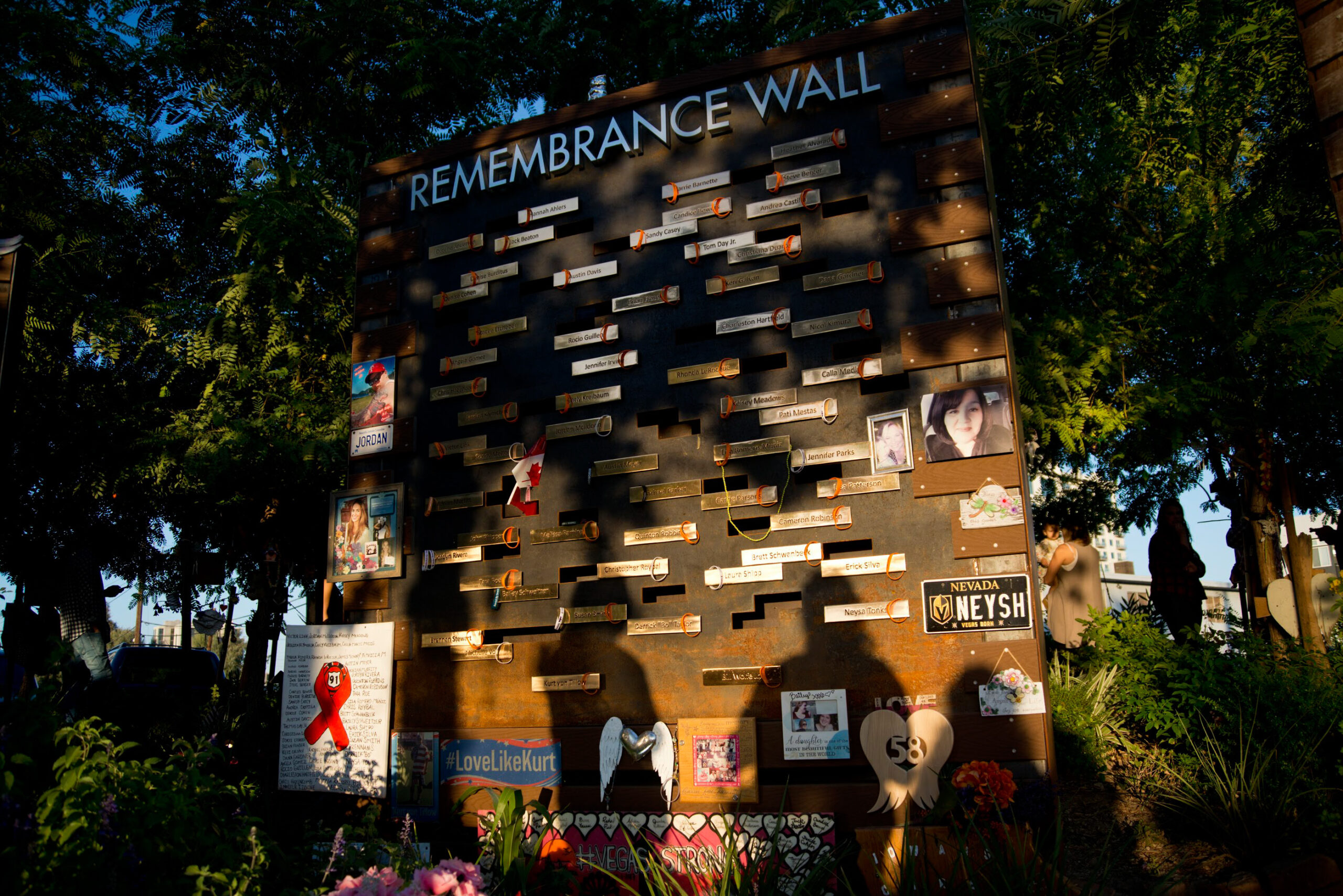 People pay respects to the victims of the Route 91 Harvest Festival shooting at the Las Vegas Community Healing Garden in Downtown Las Vegas on Friday, Oct. 1, 2019. (Daniel Clark/The Nevada Independent).