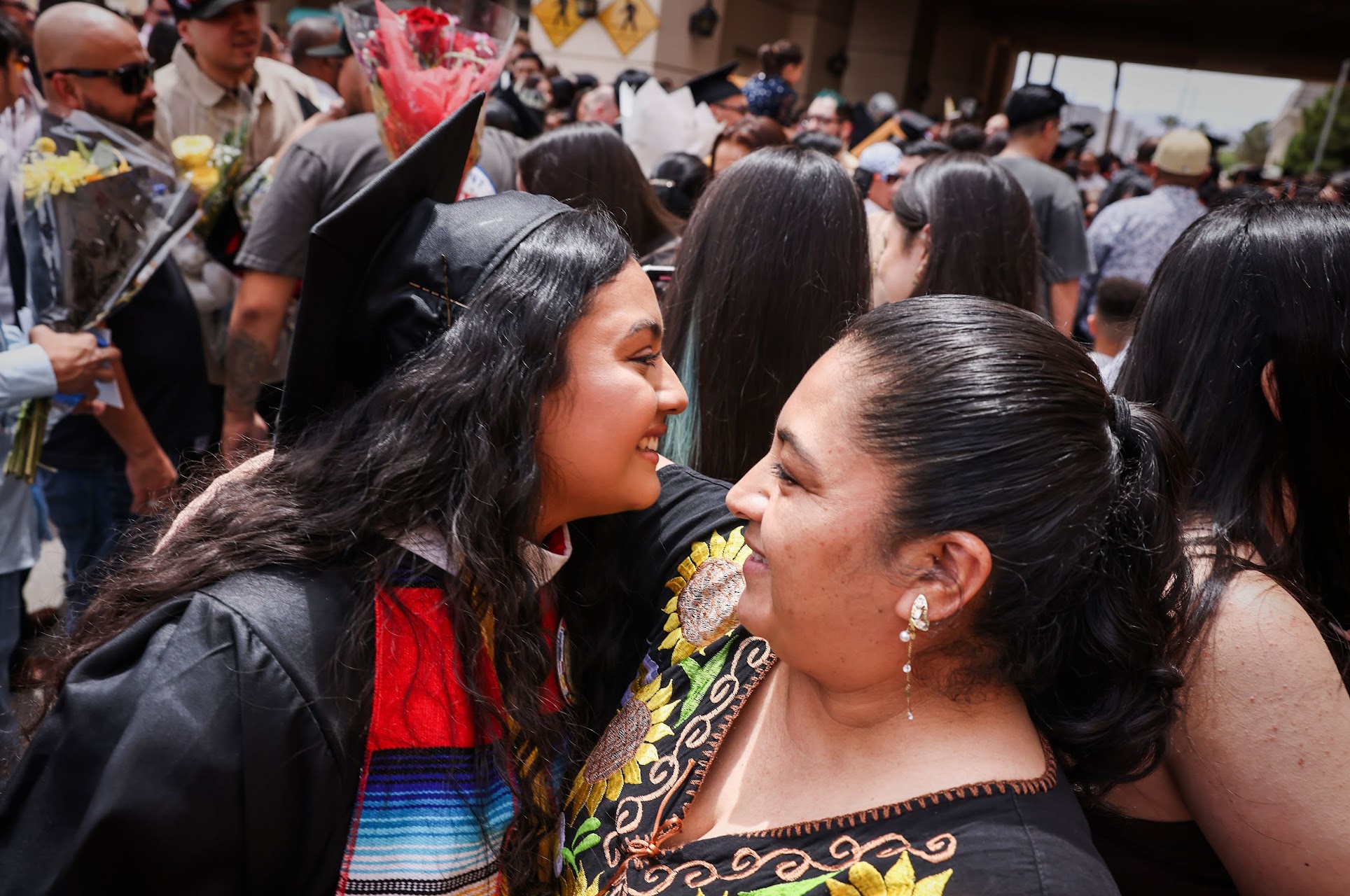 Citlali Bravo Reyes, Southeast Career and Technical Academy class of 2023 graduate, hugs her mom Gloria Reyes after receiving her diploma on Thursday, May 25, 2023. (Jeff Scheid/The Nevada Independent).