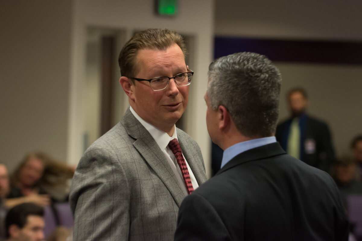 Ben Kieckhefer, chief of staff to Gov. Joe Lombardo, talks with Assembly Speaker Steve Yeager before a hearing on SB509 on Monday, May 29, 2023. (David Calvert/The Nevada Independent).