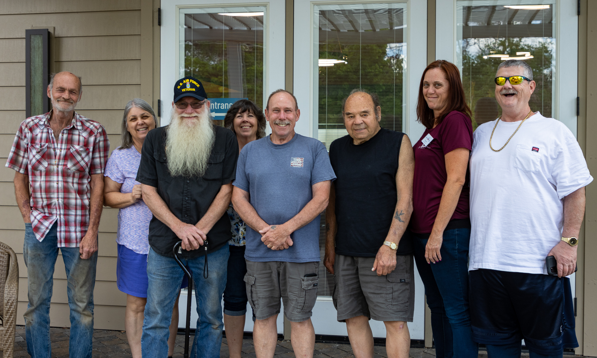 Dyana Parks, second from the right, poses with guests at the Veteran Guest House in Reno on Tuesday, May 23, 2023. (Tim Lenard/The Nevada Independent).