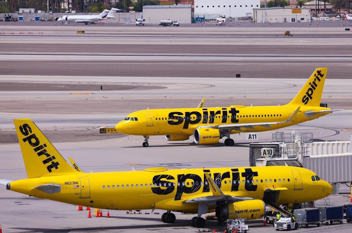 Luggage is loaded onto a Spirit Airlines jet while a second gets ready to depart from the A Gates at Harry Reid International Airport on Wednesday, May 24, 2023. (Jeff Scheid/The Nevada Independent).