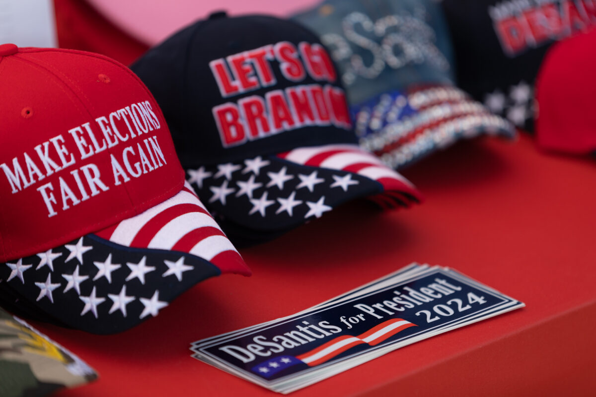 Ron DeSantis stickers and hats for sale during the 8th annual Basque Fry at Corley Ranch in Gardnerville on June 17, 2023. (Trevor Bexon/The Nevada Independent).