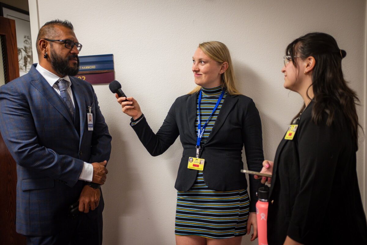 Reporters Alex Couraud (middle) and Jannelle Calderón (right) interviewing lobbyist Vince Saavedra (left) on the final day of the regular legislative session, June 5, 2023, in Carson City. (Joey Lovato/The Nevada Independent).