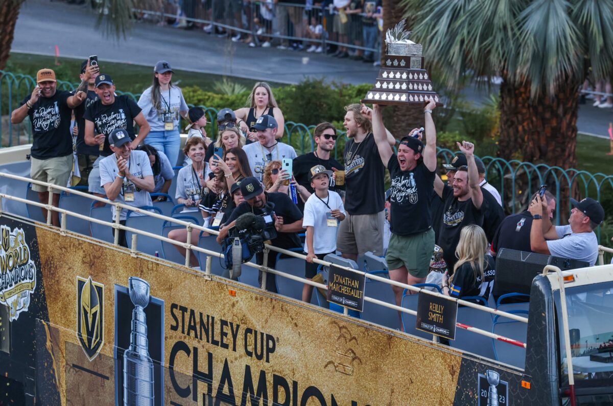 Vegas Golden Knights player Jonathan Marchessault holds the Conn Smythe trophy during the Stanley Cup Championship parade on Saturday, June 17, 2023. (Jeff Scheid/The Nevada Independent).