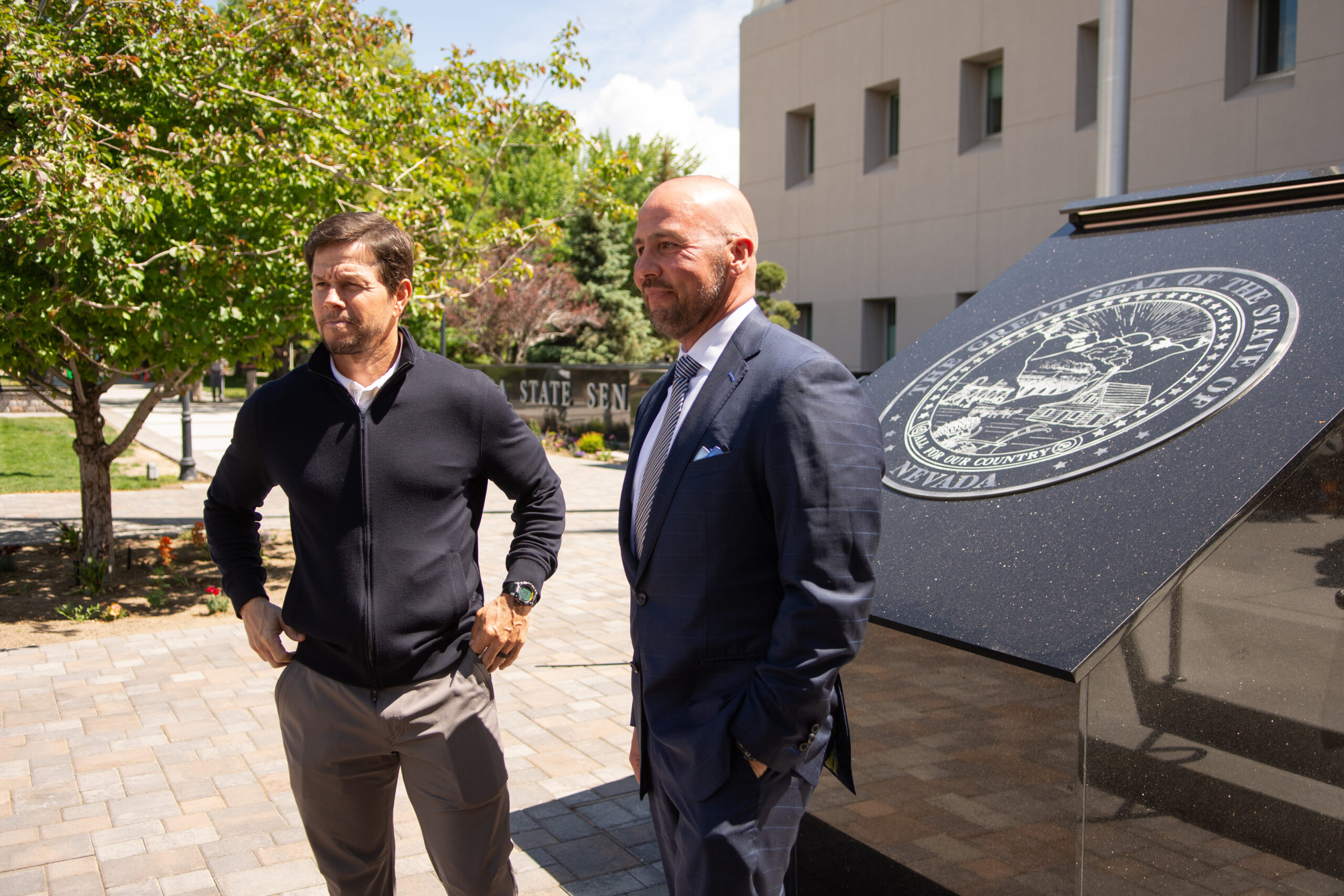 Actor Mark Wahlberg, left, and David O'Reilly, chief executive officer at The Howard Hughes Corporation outside the Legislature in Carson City on May 31, 2023. (David Calvert/The Nevada Independent).