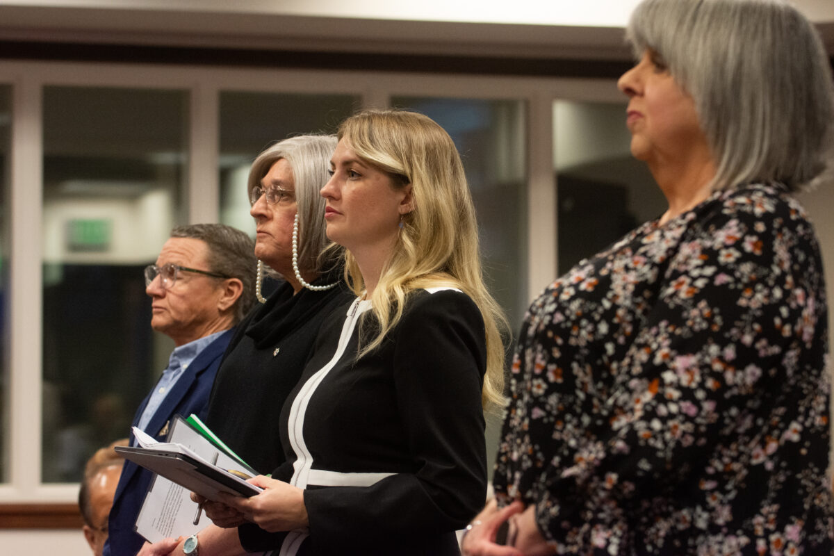 Senator Melanie Scheible, center, stands with supporters of SB163 during a Senate Commerce and Labor Committee hearing at the Legislature on March 15, 2023 in Carson City. (David Calvert/The Nevada Independent).