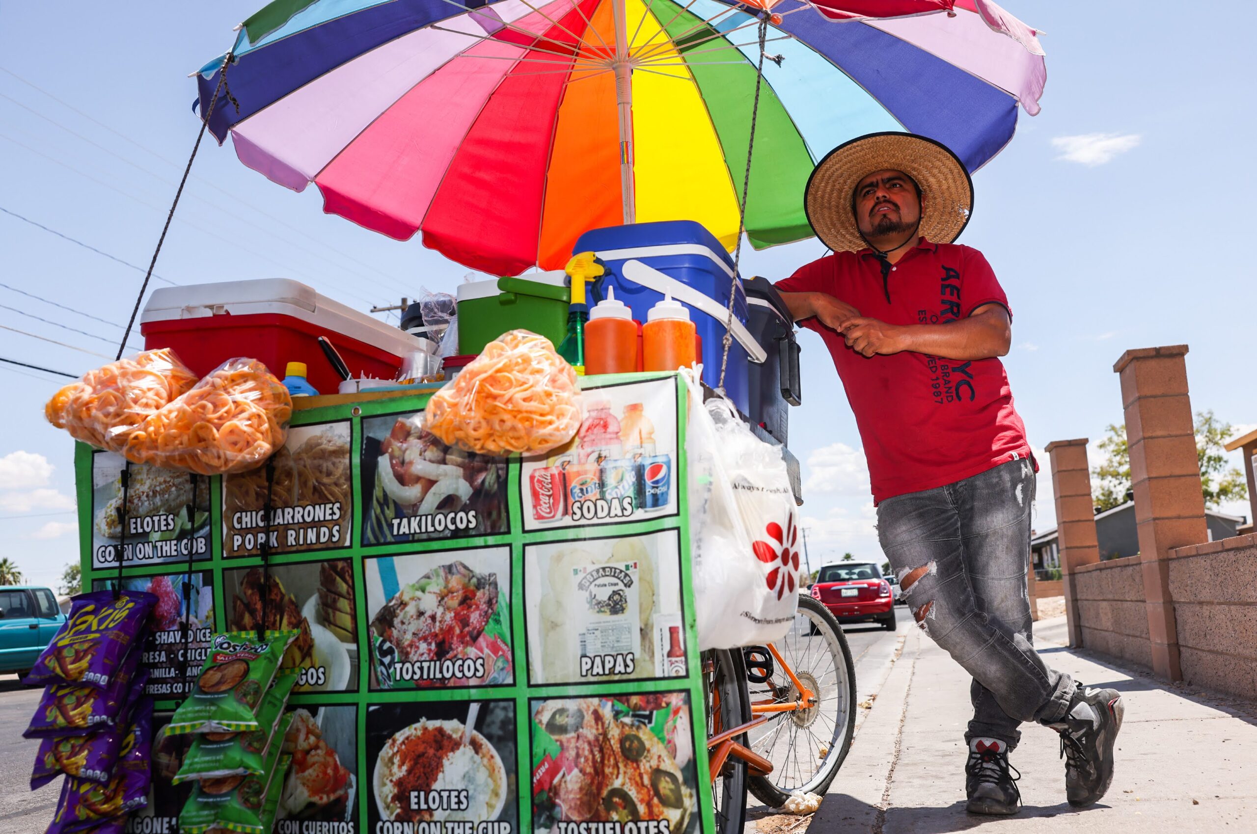 Street vendor Luis Sanchez waits for costumers at his stand in North Las Vegas on Tuesday, June 13, 2023. (Jeff Scheid/The Nevada Independent).