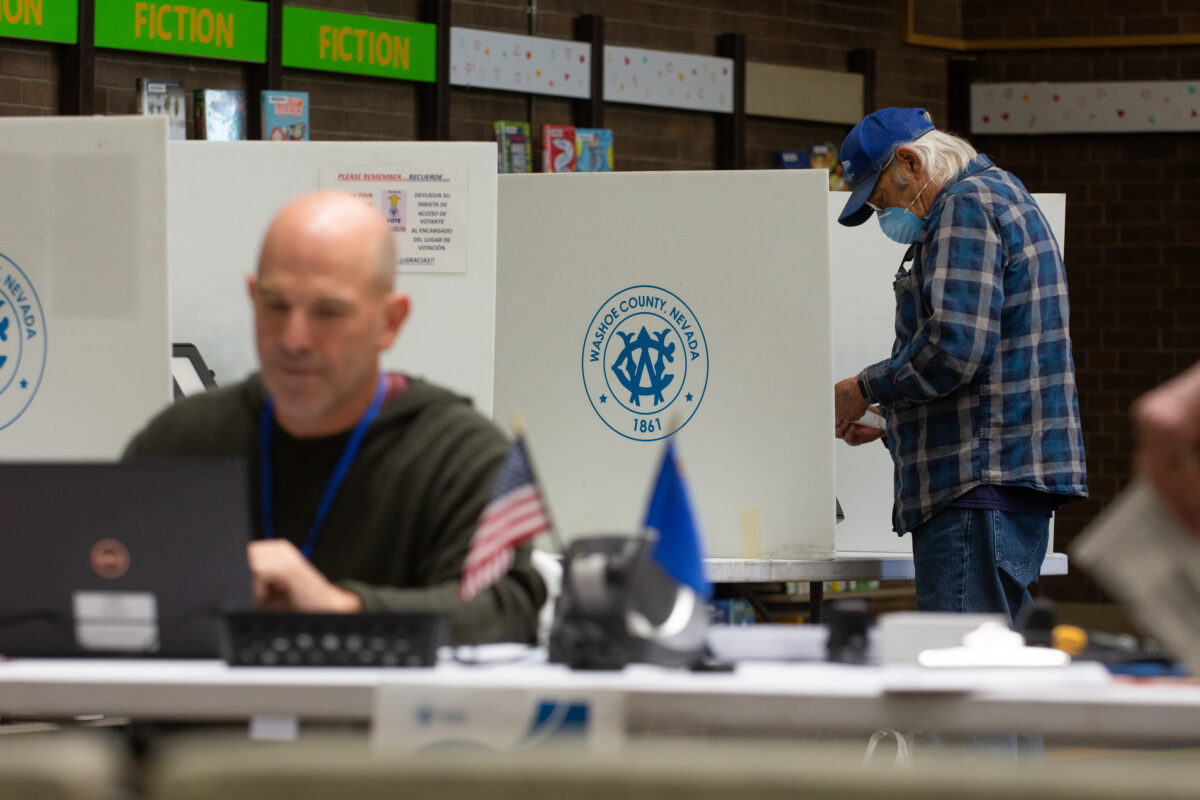 A man votes inside the Downtown Library on primary Election Day, in Reno on June 14, 2022. (David Calvert/The Nevada Independent).