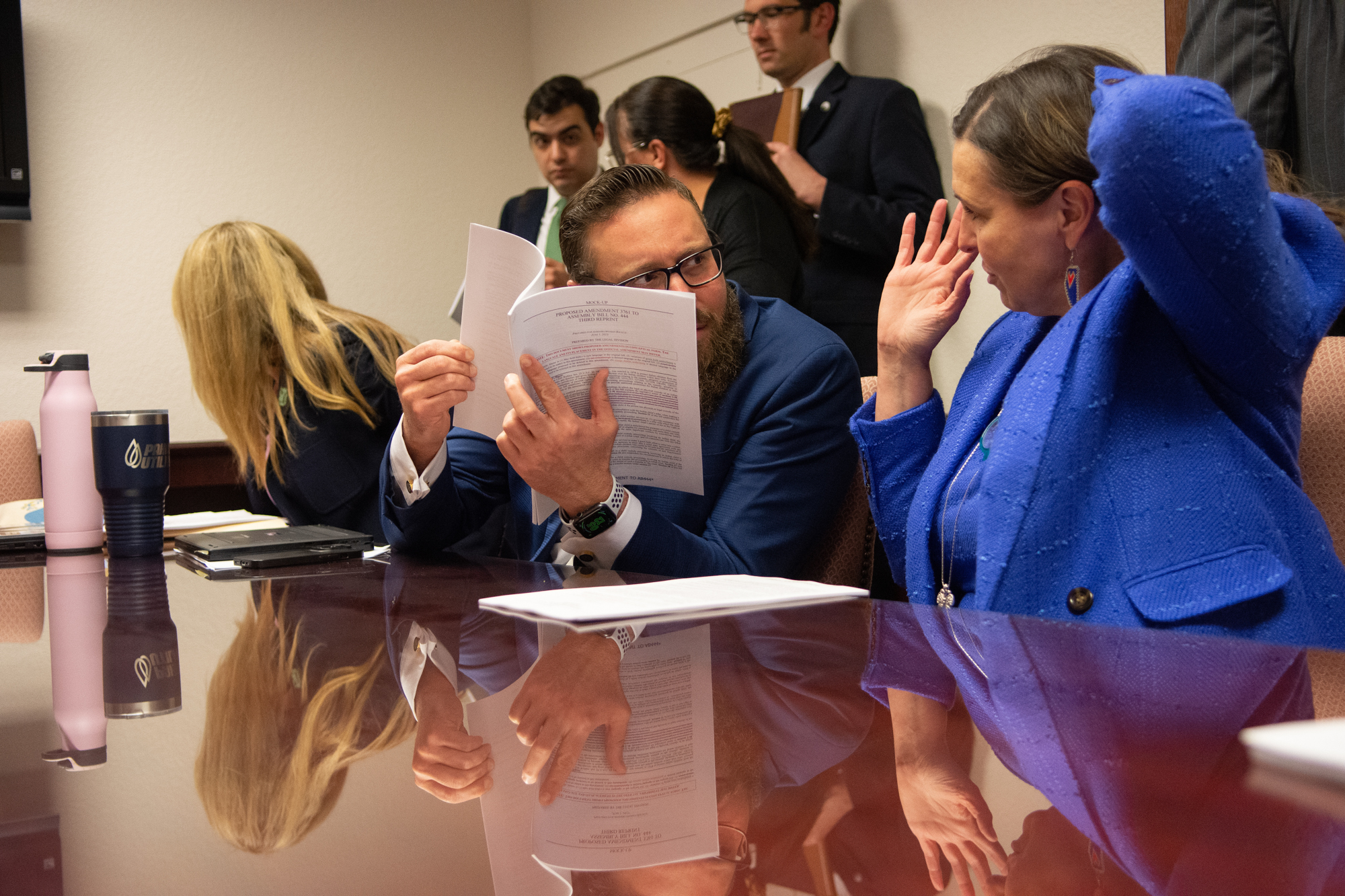 From left, Assembly members Michelle Gorelow (D-Las Vegas), Greg Hafen (R-Pahrump) and Shea Backus (D-Las Vegas) during a conference committee meeting inside the Legislature during the 82nd legislative session at the in Carson City on June 5, 2023. (David Calvert/The Nevada Independent).