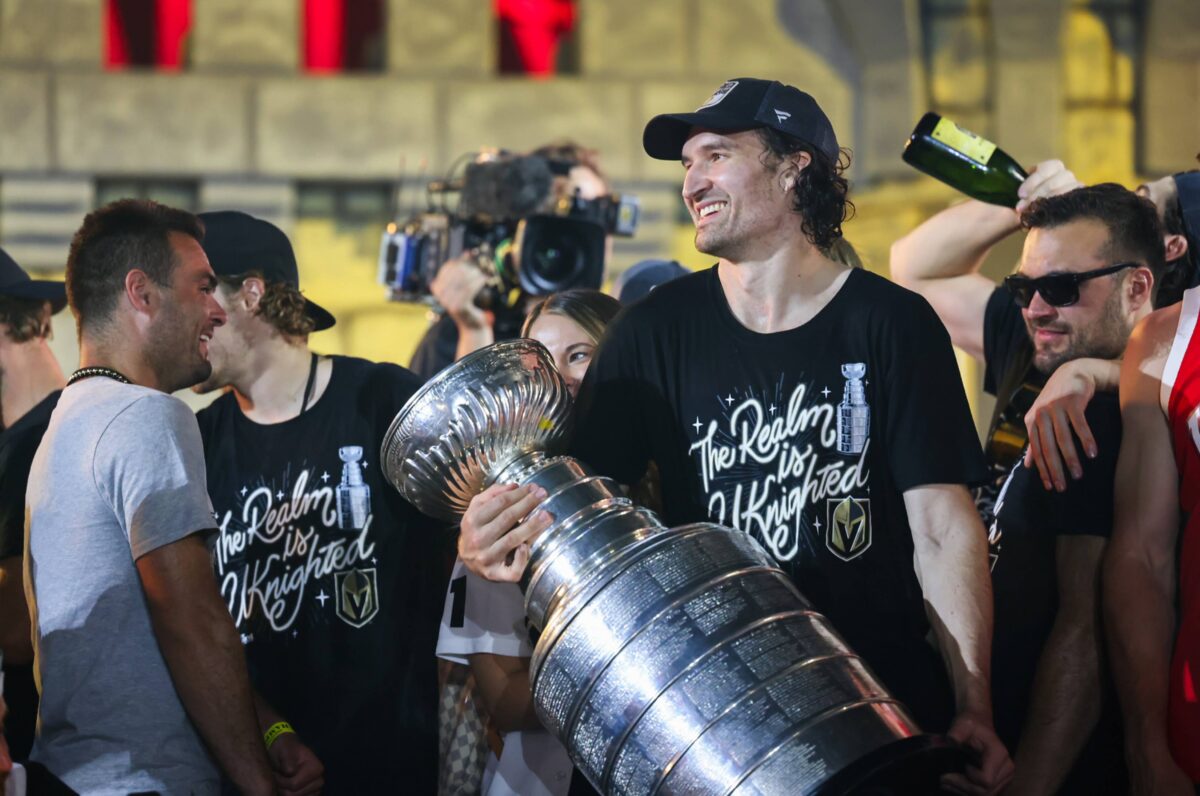 Vegas Golden Knights Captain Mark Stone holds the Stanley Cup during a party in front of T-Mobile Arena on Saturday, June 17, 2023. (Jeff Scheid/The Nevada Independent).