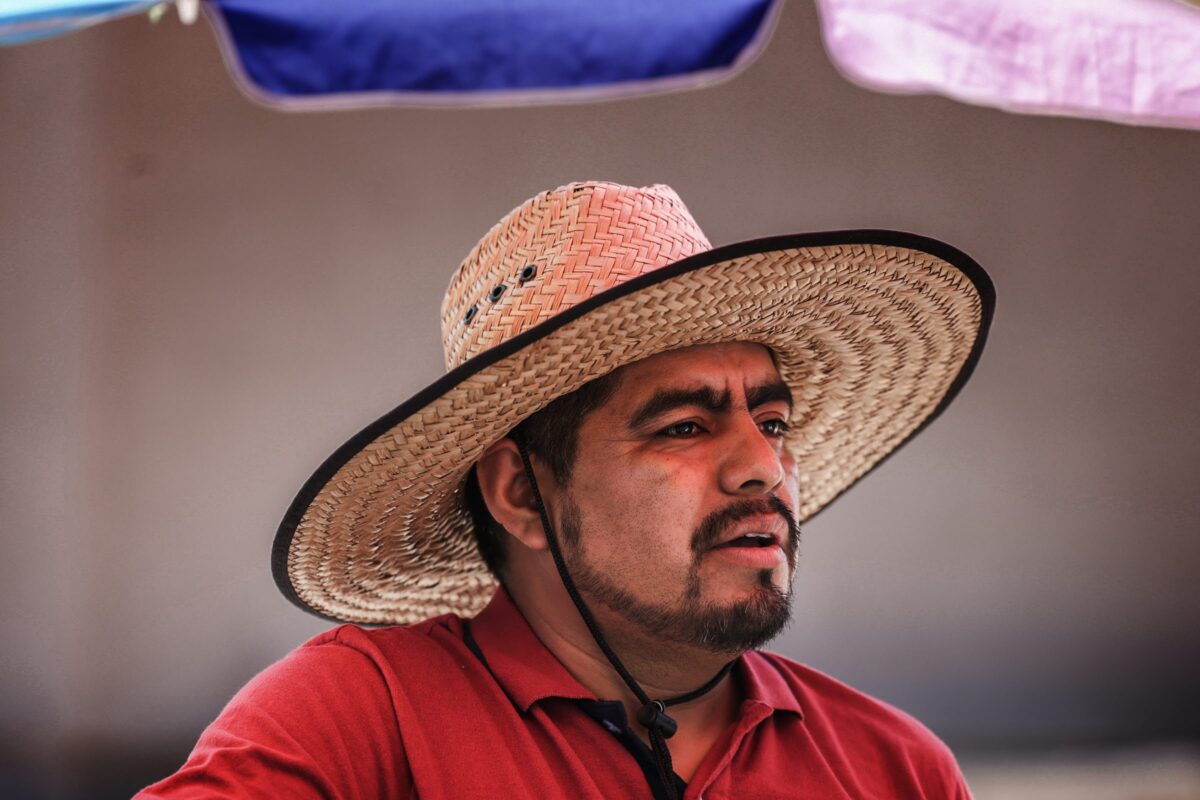 Street vendor Luis Sanchez waits for costumers at his stand in North Las Vegas on Tuesday, June 13, 2023. (Jeff Scheid/The Nevada Independent)