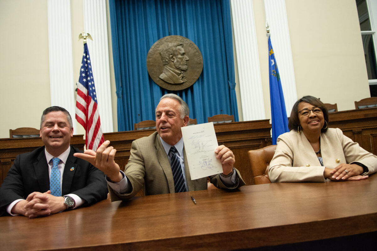 From left, Assembly Speaker Steve Yeager (D-Las Vegas), Gov. Joe Lombardo and Assemblywoman Daniele Monroe-Moreno (D-North Las Vegas) during a bill signing ceremony for SB503, the K-12 education funding bill, inside the Capitol in Carson City on May 31, 2023. (David Calvert/The Nevada Independent).