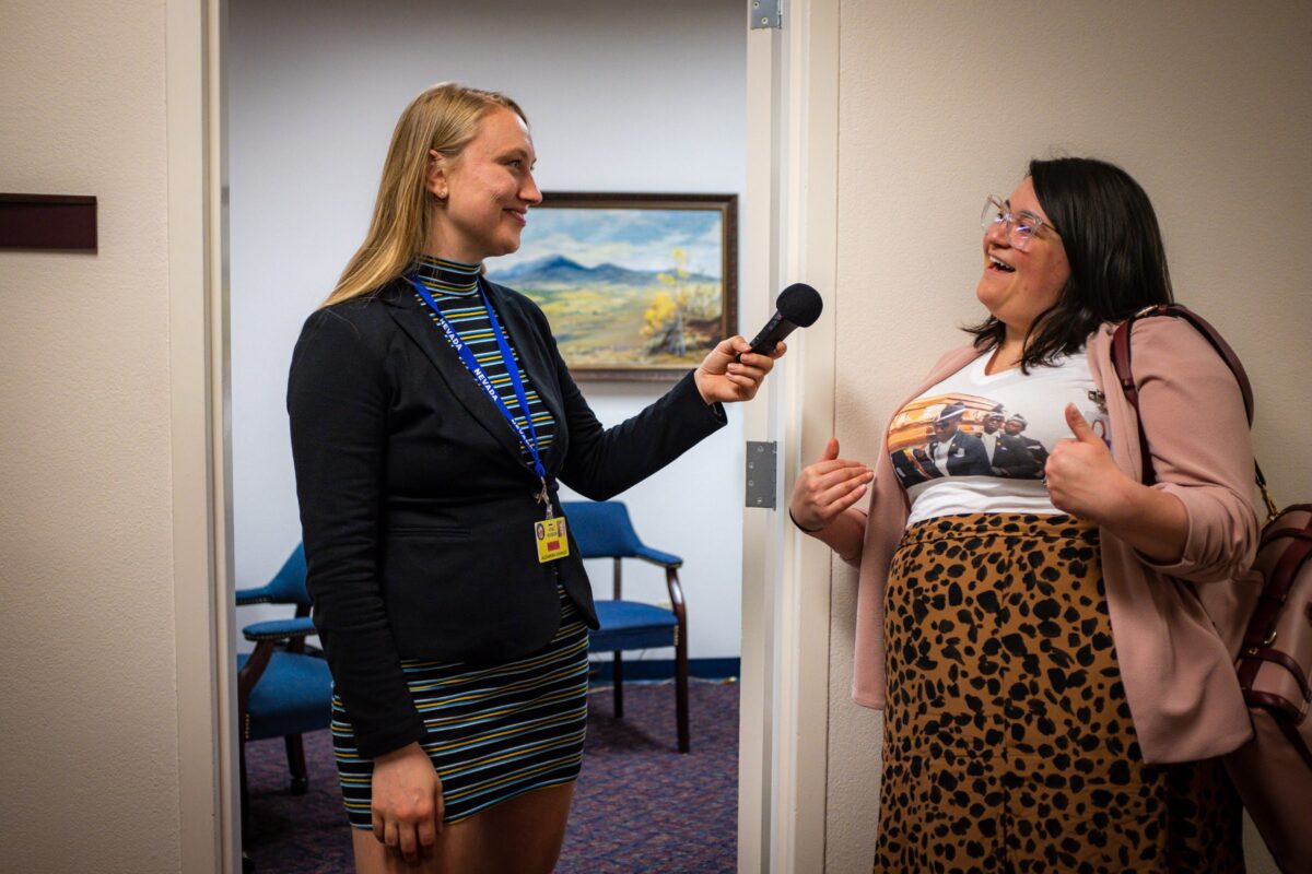 Reporter Alex Couraud (left) interviewing lobbyist Elyse Monroy (right) on the final day of the legislative session, June 5, 2023, in Carson City. (Joey Lovato/The Nevada Independent).