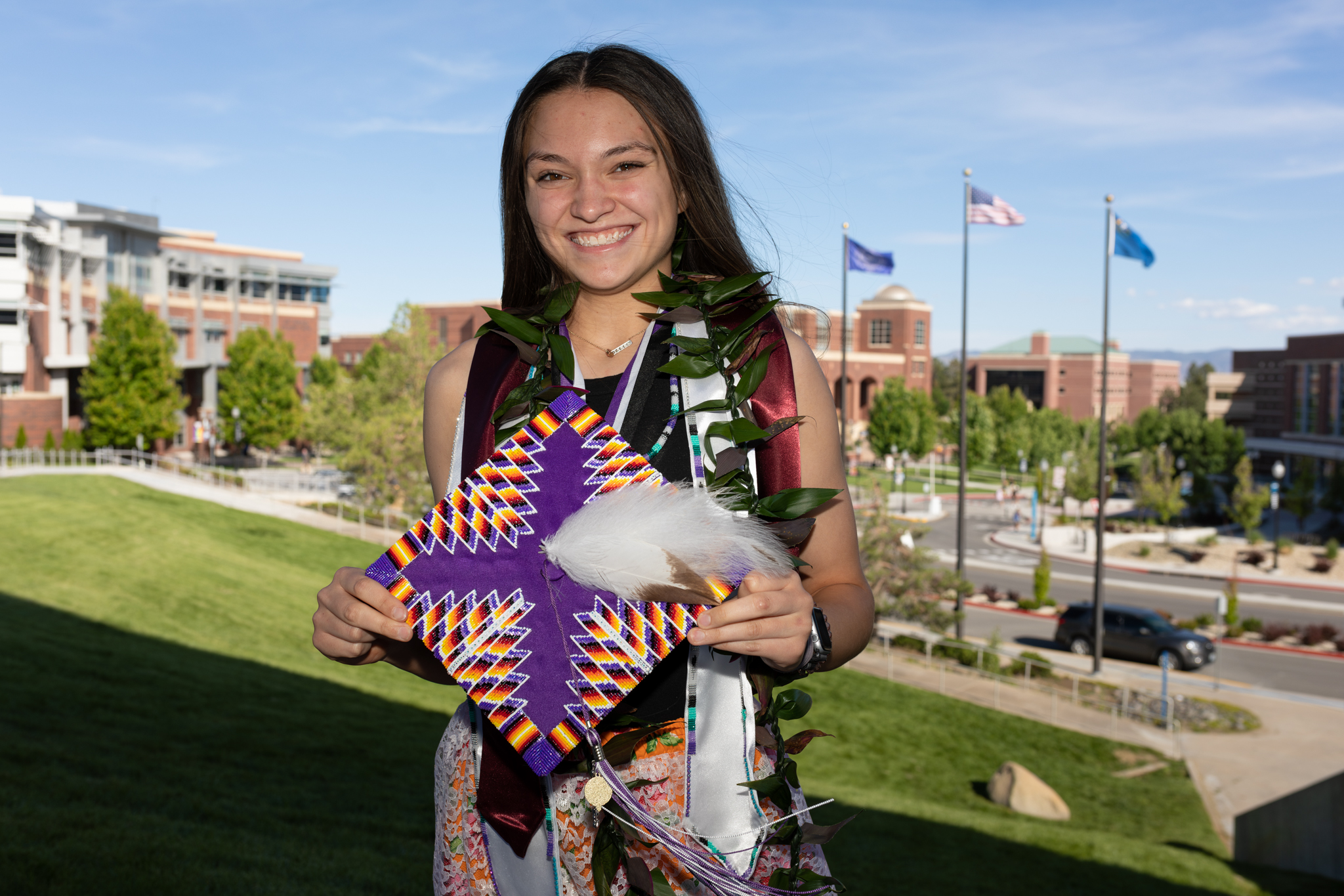 Spanish Springs High School student Kyla Kaufman shows her graduate cap outside of Lawlor Events Center in Reno on June 15, 2023. (Trevor Bexon/The Nevada Independent).