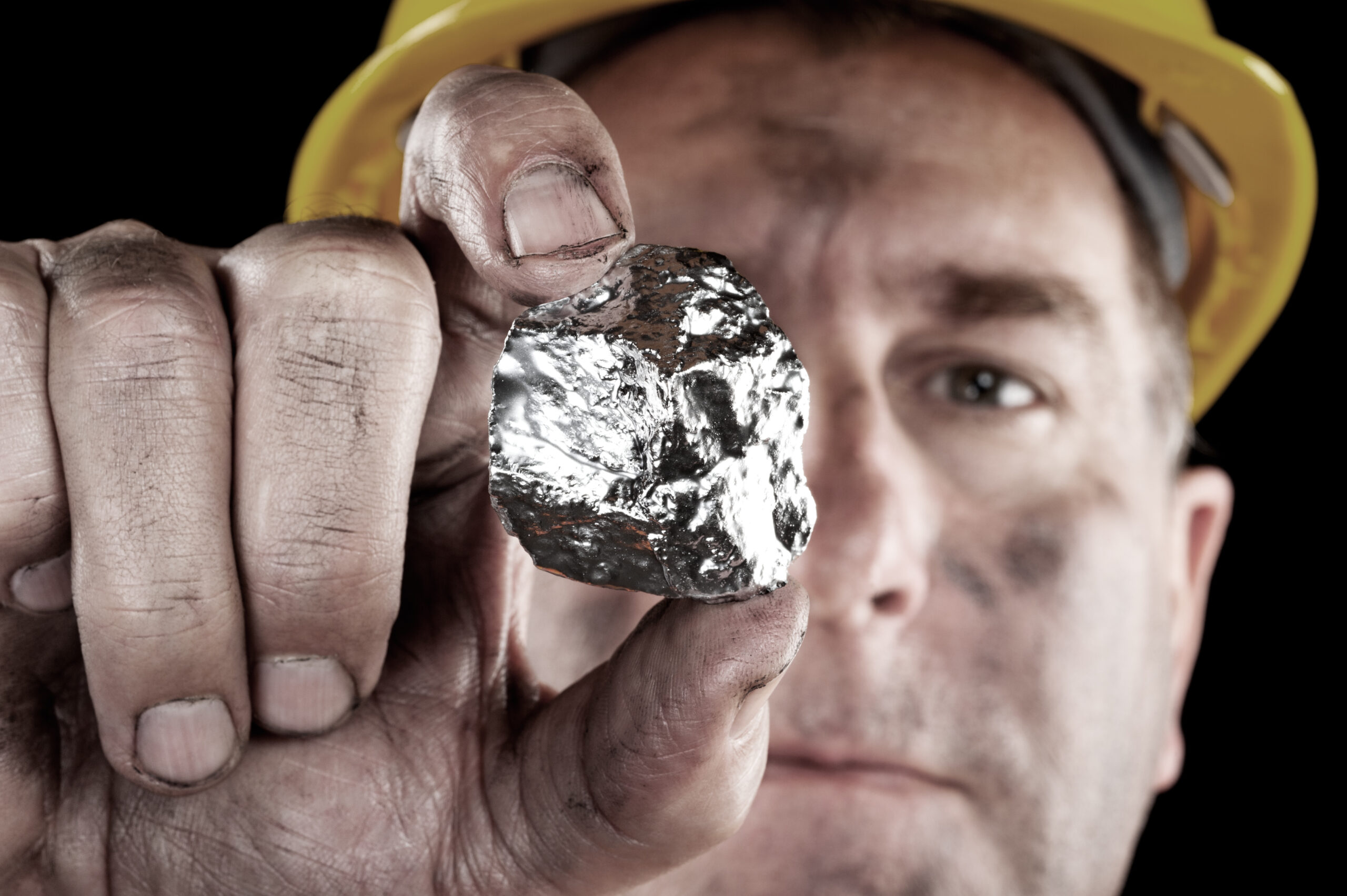 A silver miner shows off his newly excavated silver nugget. (Joe Belanger/iStock.com).