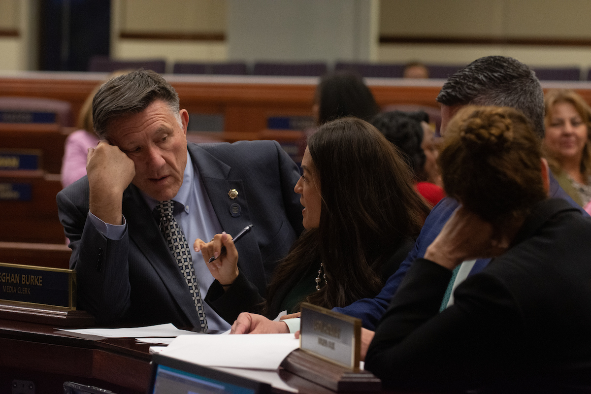 From left, Assembly Minority Leader P.K. O'Neill (R-Carson City), Floor Leader Sandra Jauregui (D-Las Vegas), Speaker Steve Yeager (D-Las Vegas) and Chief Clerk Susan Furlong inside the Legislature in Carson City on June 4, 2023. (David Calvert/The Nevada Independent).