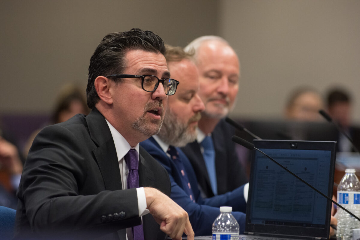 From left, Applied Analysis principal analyst Jeremy Aguero, State Treasurer Zach Conine and Las Vegas Convention and Visitors Authority CEO Steve Hill testify on SB509 on Monday, May 29, 2023, in Carson City. (David Calvert/The Nevada Independent).