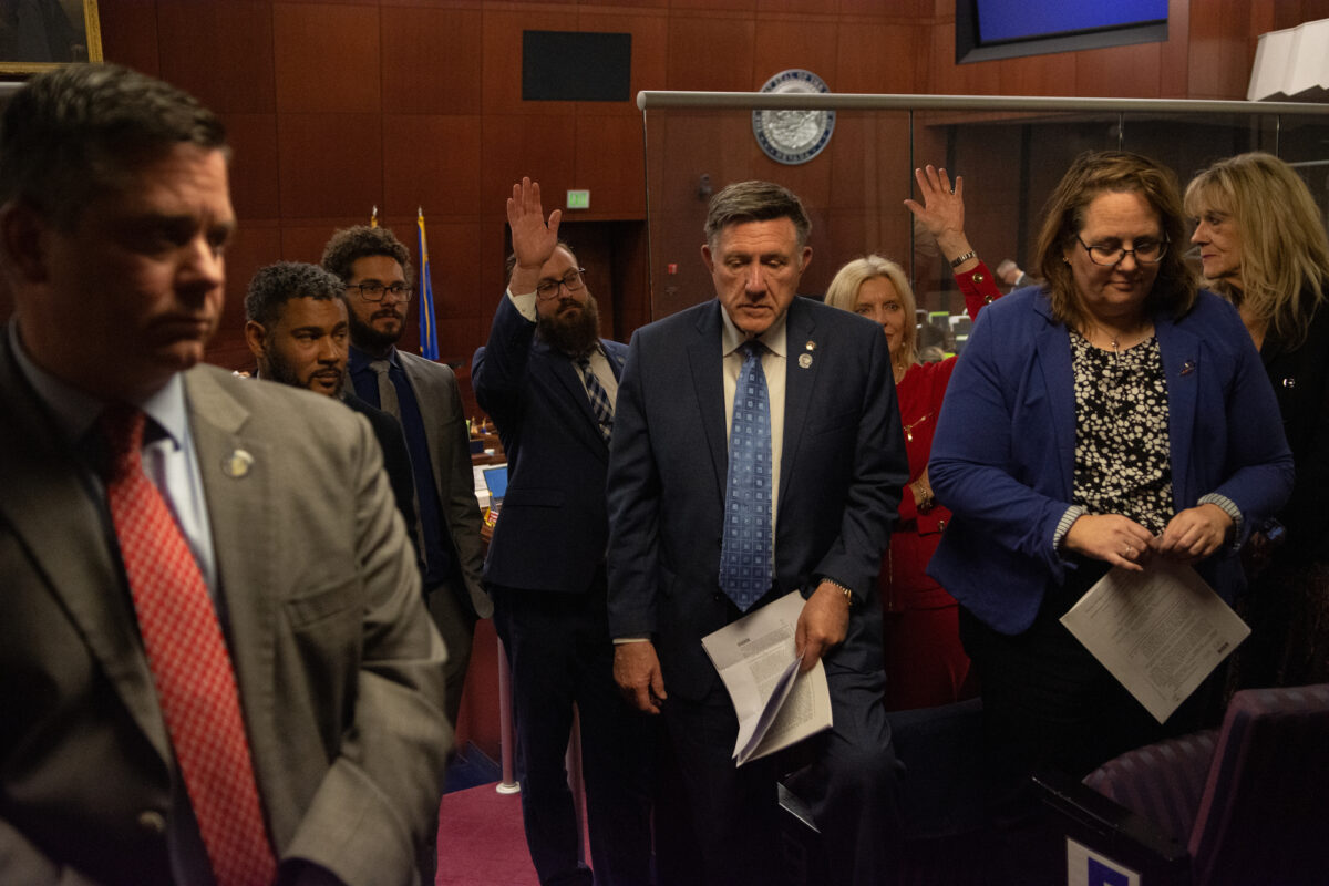 The Assembly Committee on Ways and Means meets behind the bar to introduce a budget bill during the 34th special session of the Legislature in Carson City on June 6, 2023. (David Calvert/The Nevada Independent).