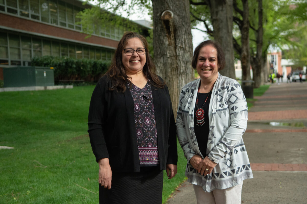 UNR Indigenous Relations Director Daphne Emm-Hooper, a member of the Walker River Paiute Tribe (left), and UNR NAGPRA liaison Rochanne Downs, a member of the Fallon Paiute Shoshone Tribe, at the university campus on May 2, 2023. (David Calvert/The Nevada Independent).