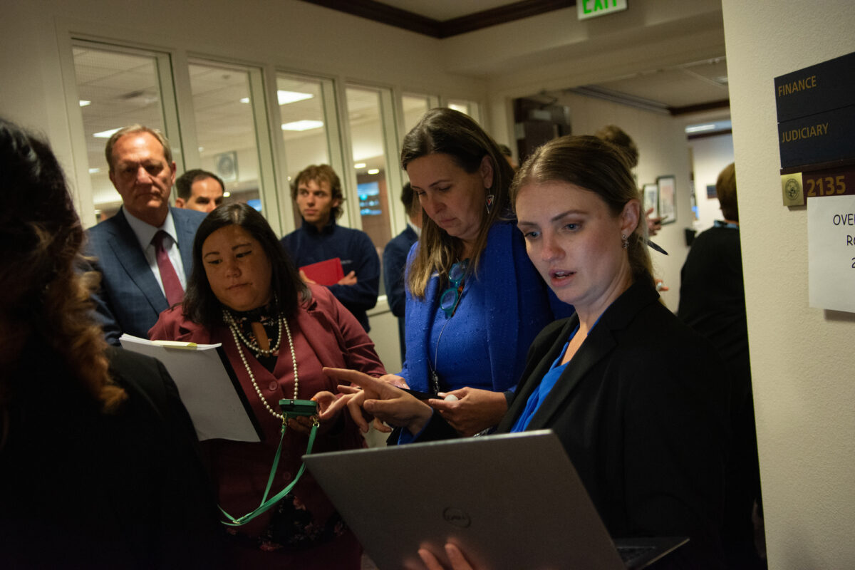 Sen. Melanie Scheible (D-Las Vegas), right, before a conference committee meeting in a hallway inside the Legislature during the 82nd legislative session in Carson City on June 5, 2023. (David Calvert/The Nevada Independent).