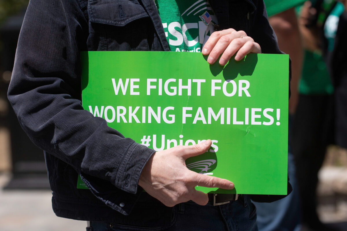 Members of AFSCME Local 4041 during a press conference outside the Legislature.