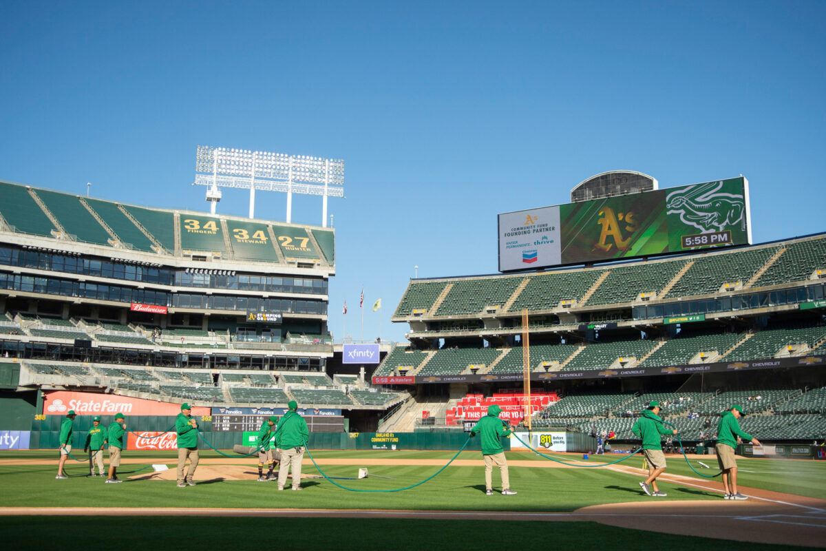 Ground crews prepare the field at the Oakland Coliseum before the game between the Oakland Athletics and Texas Rangers on Friday, May 12, 2023. (David Calvert/The Nevada Independent)