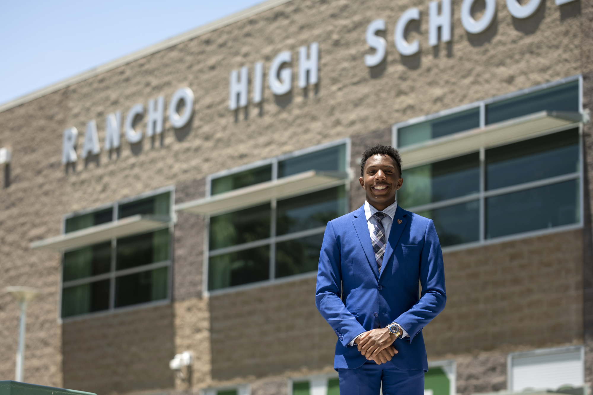 John Cooke poses for a portrait at his alma mater Rancho High School in Las Vegas on Monday, July 3, 2023. (Daniel Clark/The Nevada Independent).