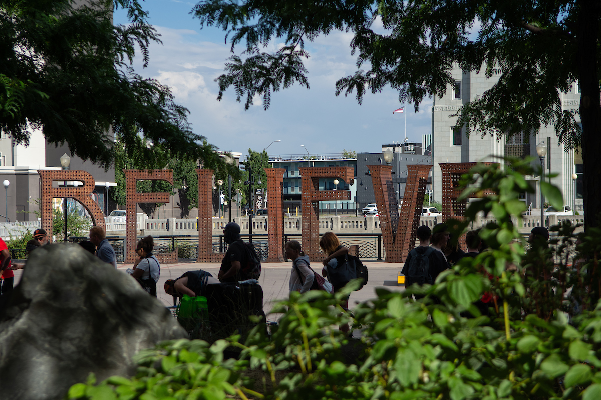 People wait in line during Family Soup Mutual Aid’s weekly distribution in downtown Reno on July 18, 2023. (David Calvert/The Nevada Independent)