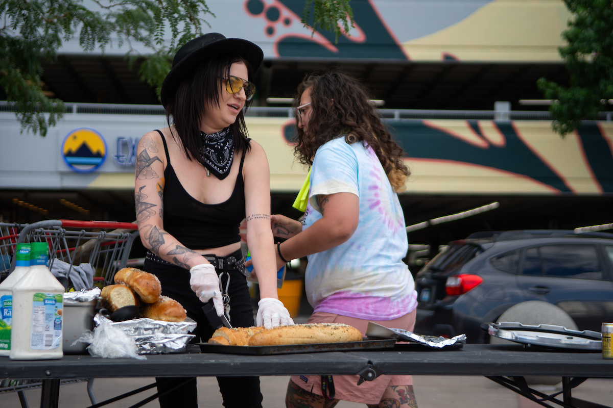 Nicole Anagapesis, left, one the founders of Family Soup Mutual Aid during the group's weekly distribution in downtown Reno on July 18, 2023. (David Calvert/The Nevada Independent)